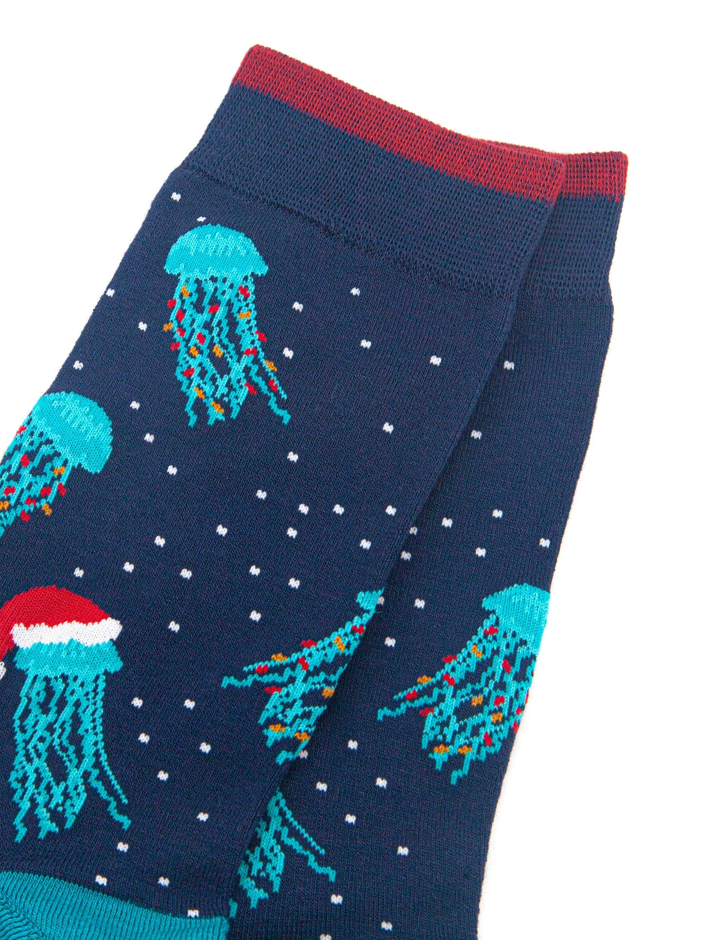 close up of the jellyfish pattern on the sock, they are electric blue with long tentacles, some have colourful party lights entwined in their tentacles, others are wearing red santa hats