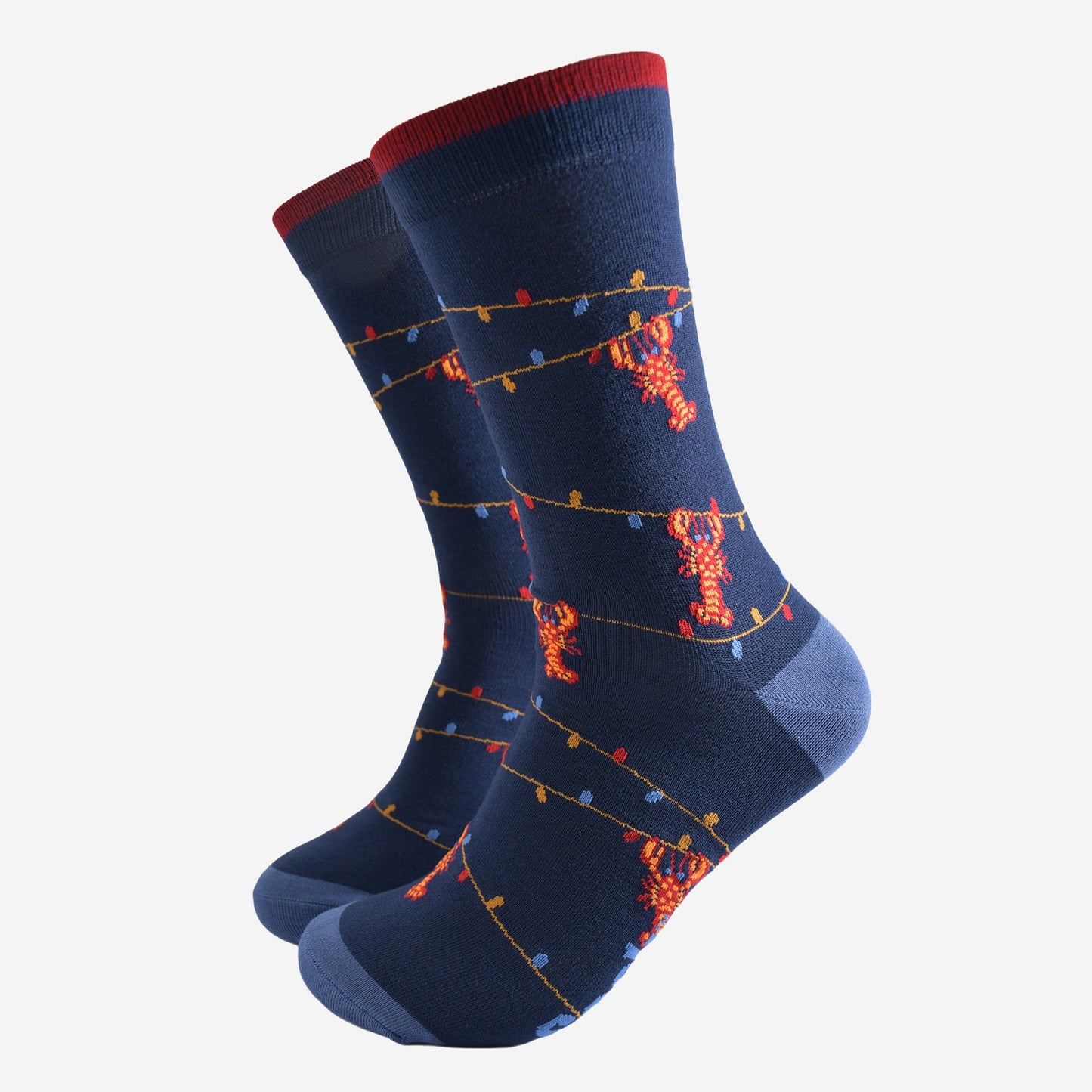 navy blue bamboo socks with a pattern of colourful party lights with red lobsters playfully dangling from them