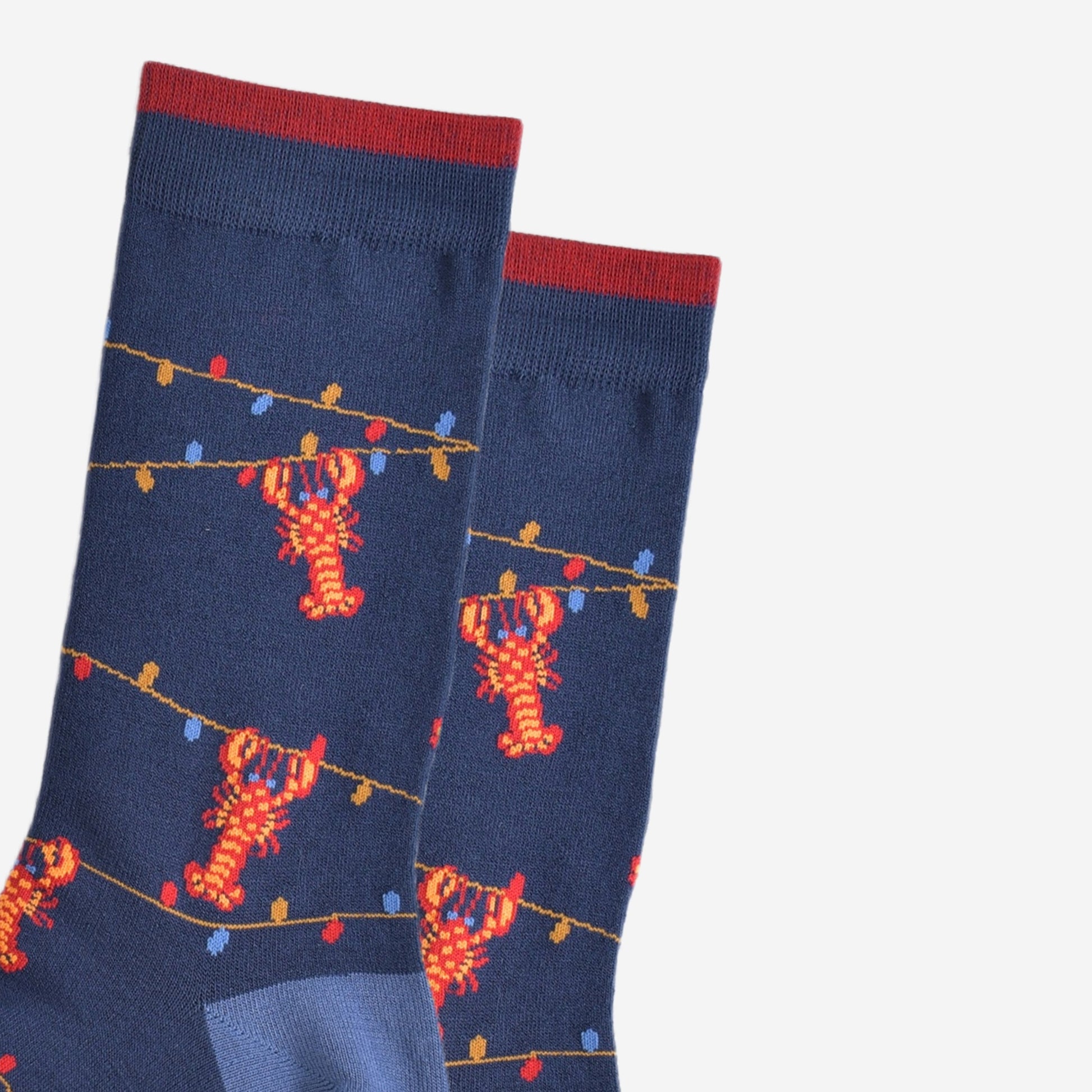 close up of the lobster and party light pattern on the bamboo socks, showing the colourful party lights 