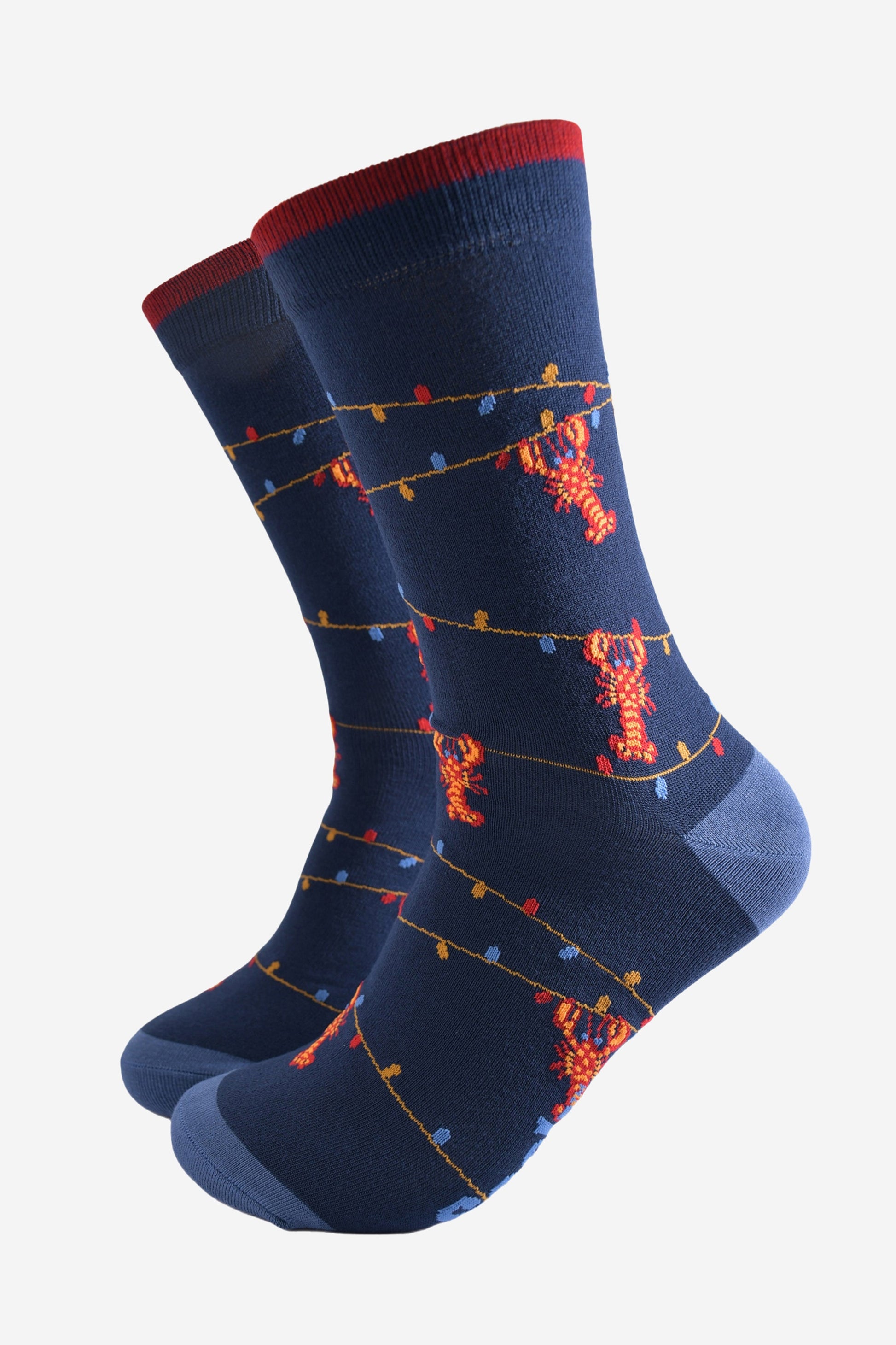 navy blue bamboo socks with a pattern of colourful party lights with red lobsters playfully dangling from them