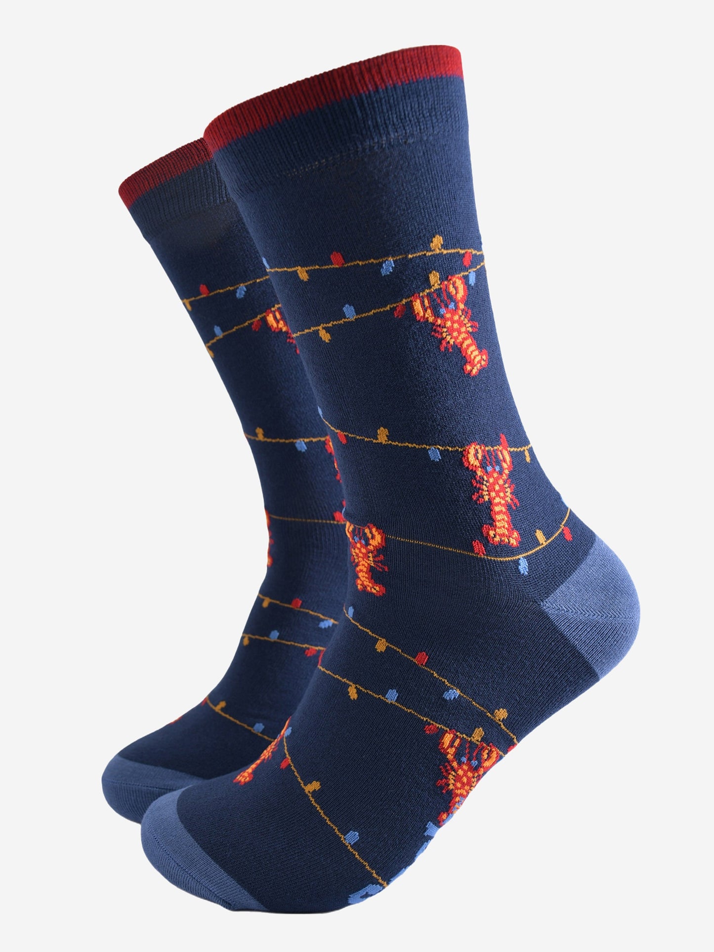 navy blue bamboo socks with a pattern of colourful party lights with red lobsters playfully dangling from them