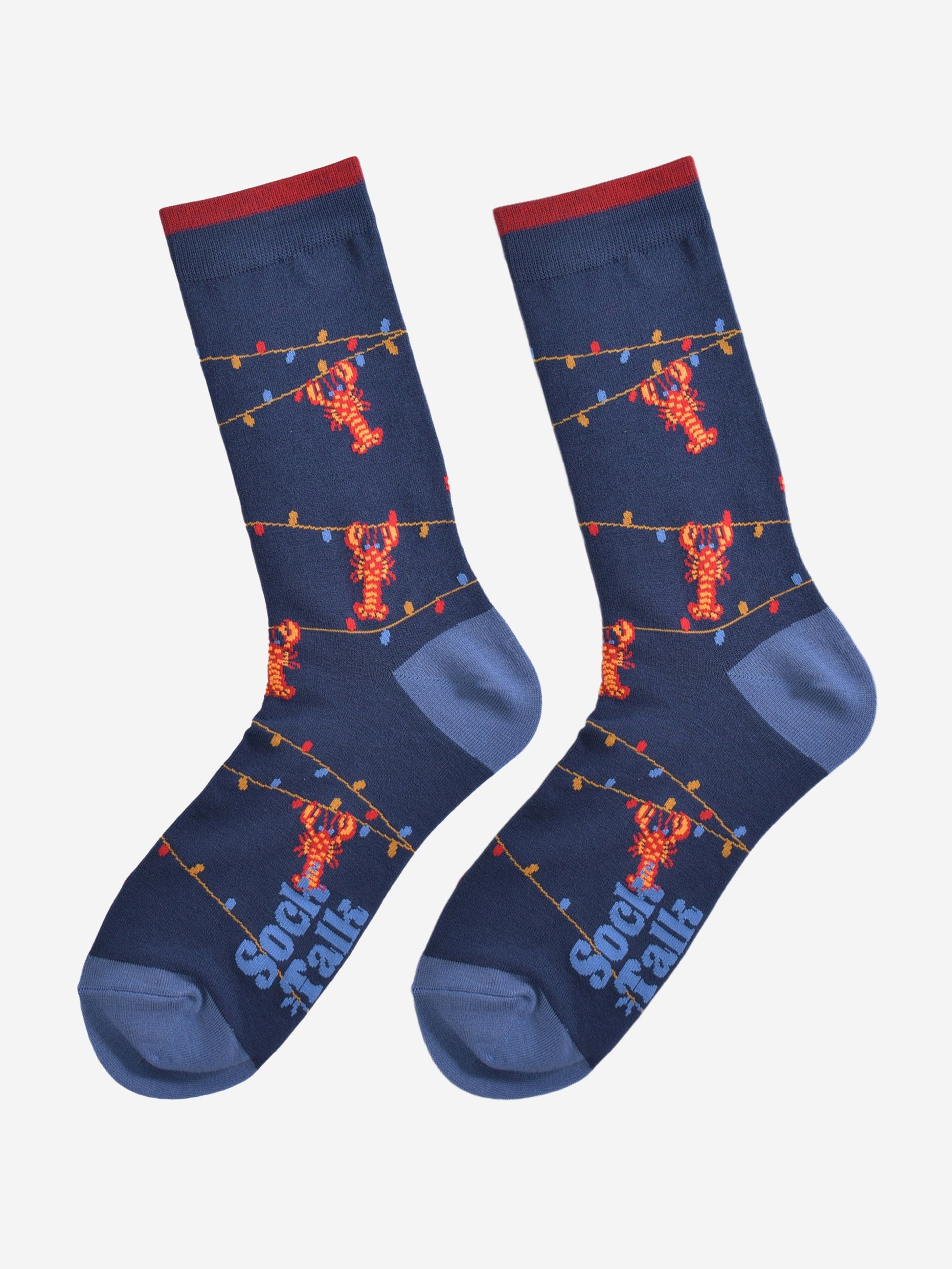 blue bamboo socks with lobsters and party lights laying flat, showing the full design of the socks