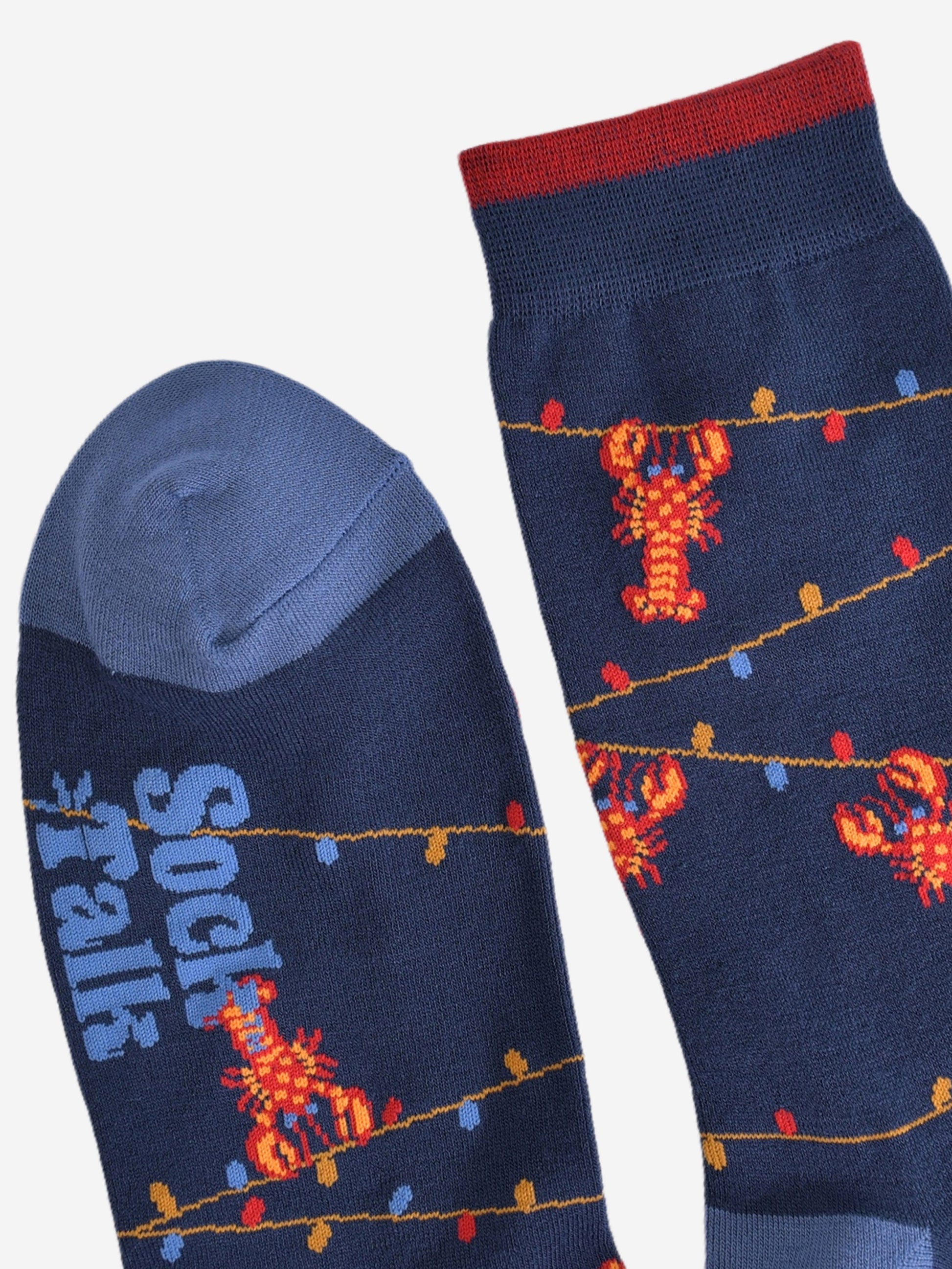 showing the toe and cuff of socks, the cuff has a small contrasting burgundy stripe, the toe is light blue