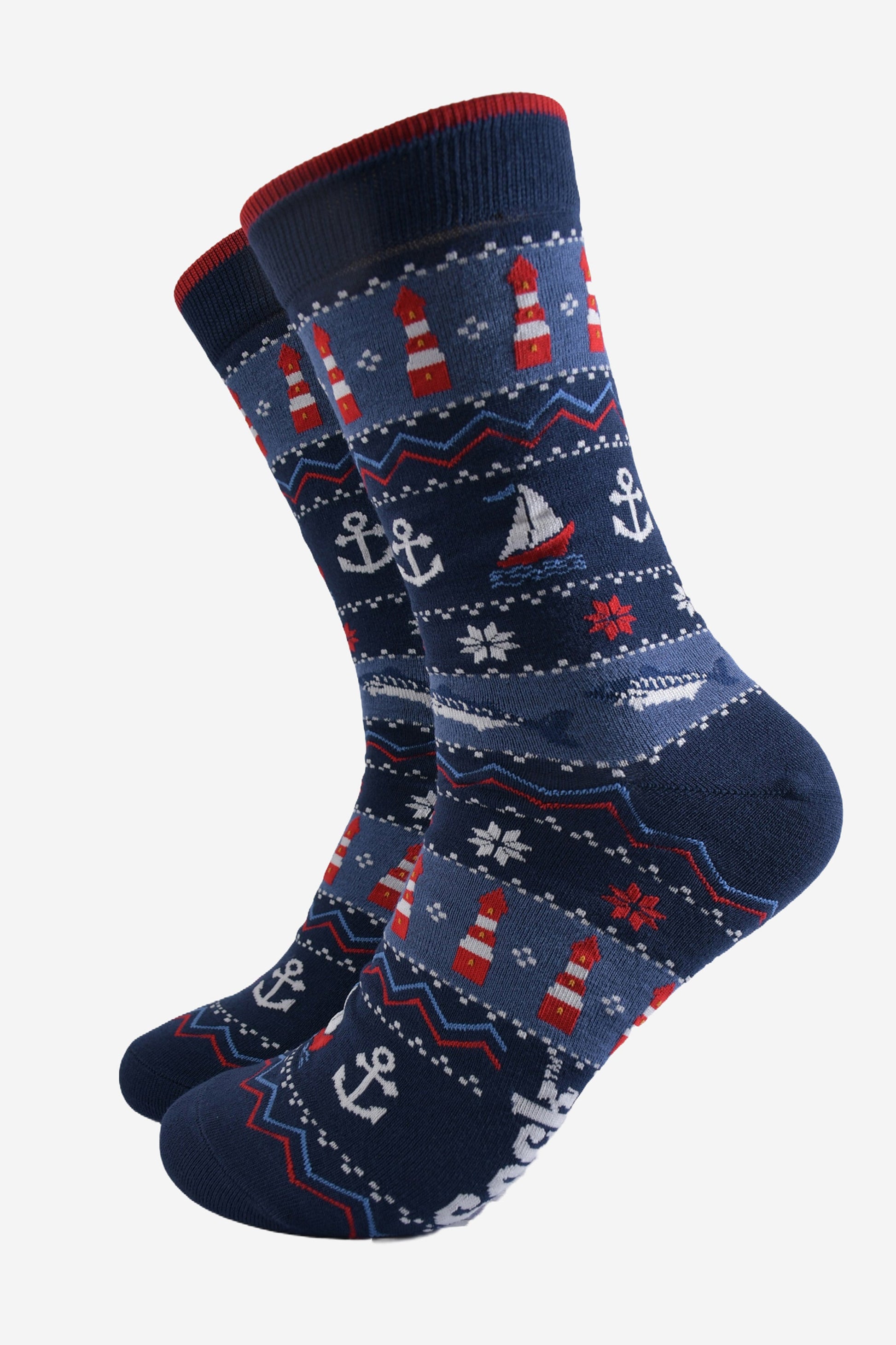 navy blue and red fair isle style bamboo socks featuring sail boats, lighthouses, anchors and snowflakes