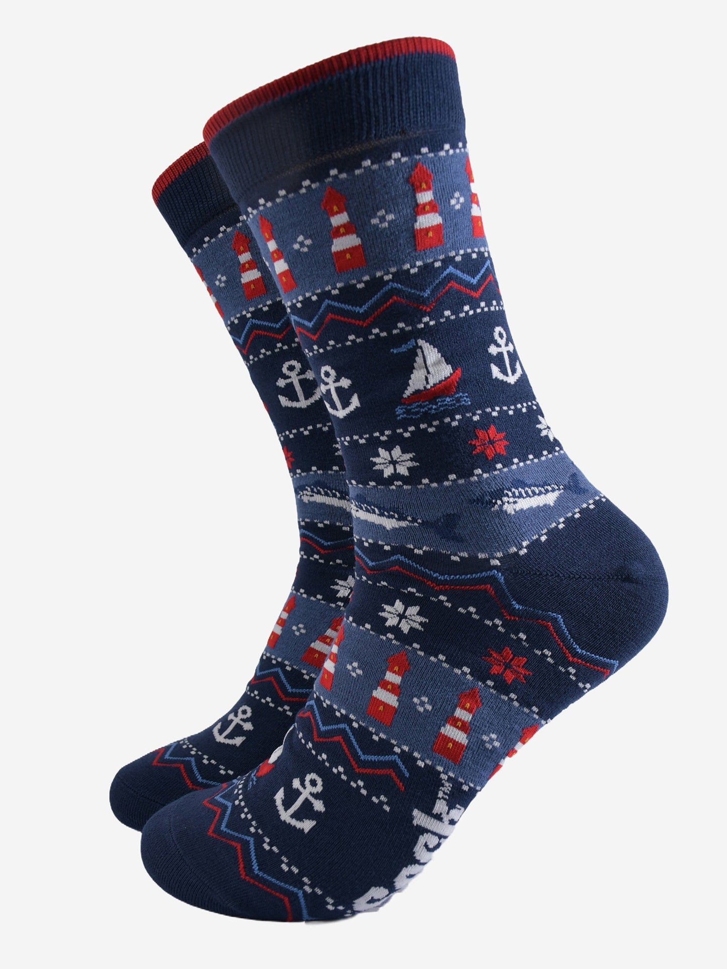 navy blue and red fair isle style bamboo socks featuring sail boats, lighthouses, anchors and snowflakes