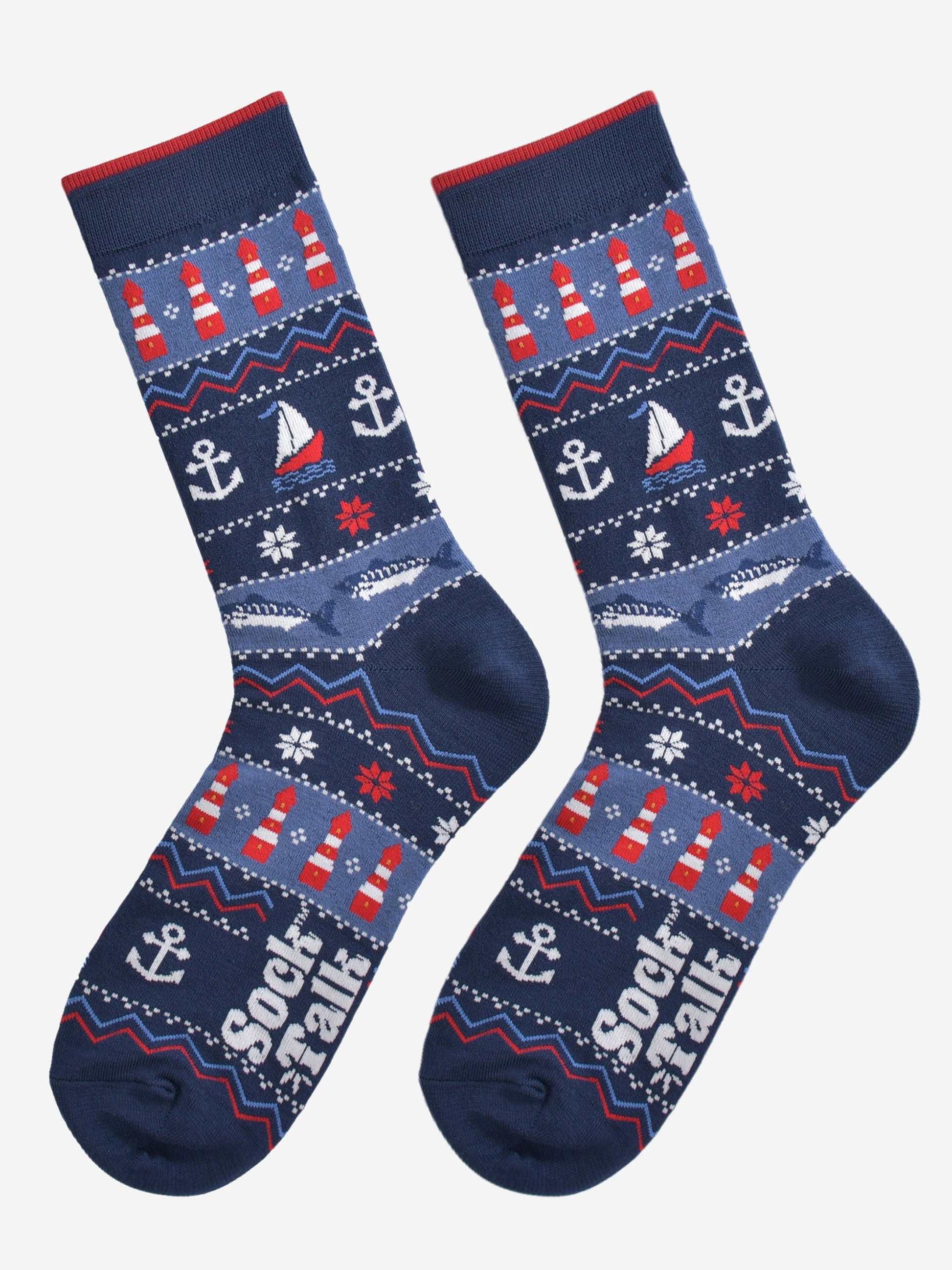 navy blue nautical fair isle socks laying flat, showing the intricate design which includes fish, anchors, boats and lighthouses