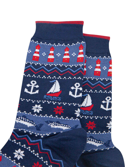 close up of the nautical designs on the socks, the lighthouses, boats, anchors and fish are shown