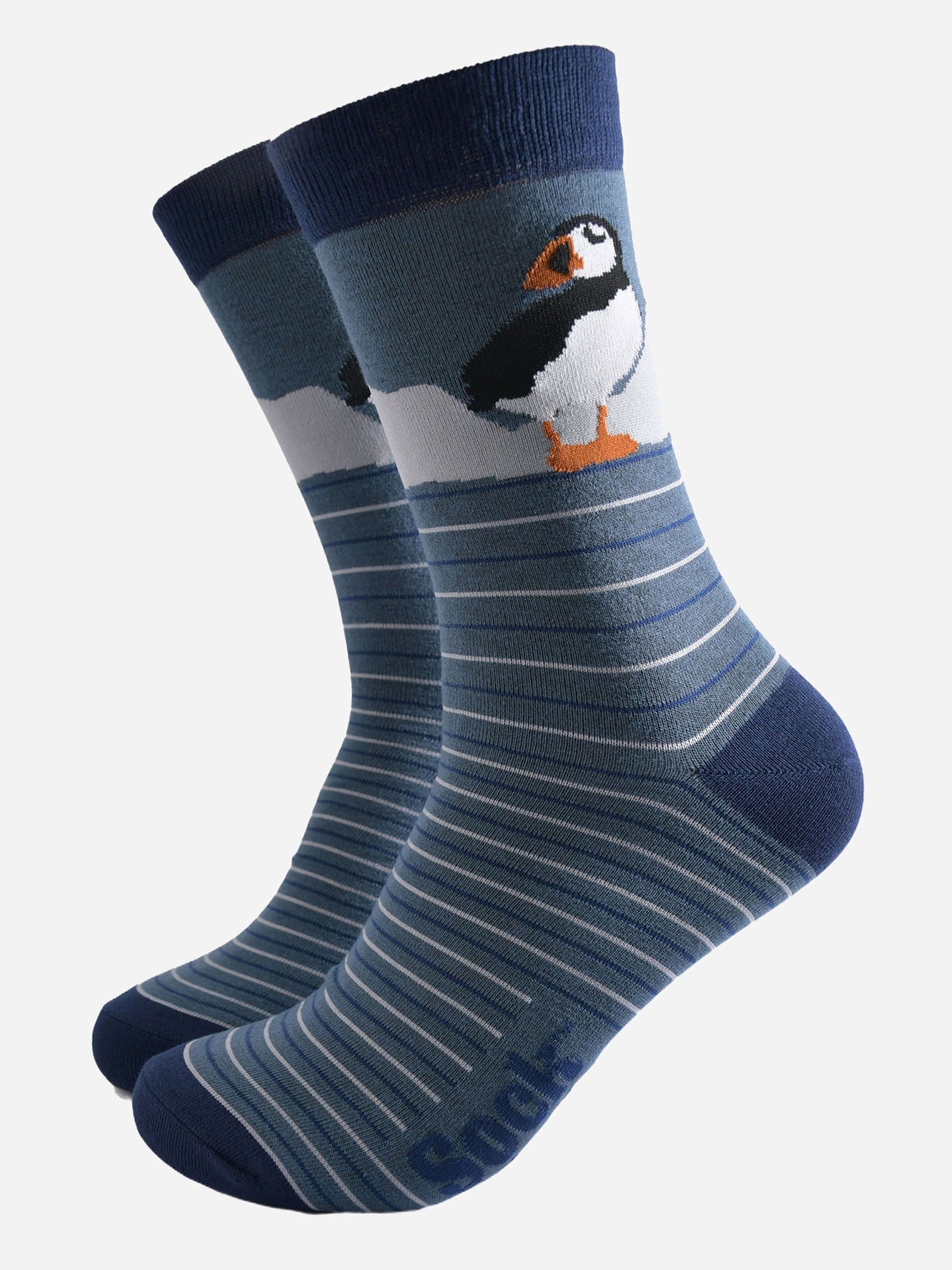 teal striped bamboo socks with navy blue heel, toe and cuff with a large puffin bird on the ankle of the socks