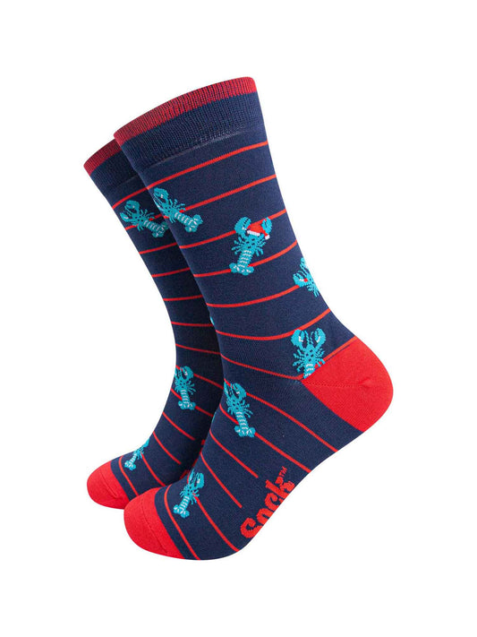 navy blue socks with a red horizontal pin stripe with a pattern of blue lobsters wearing santa hats