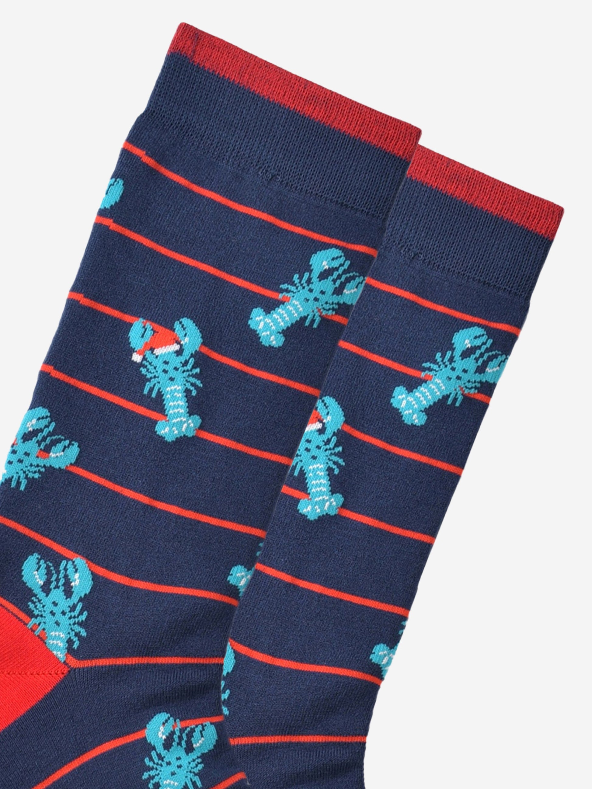 close up of the lobster pattern showing clearly the blue lobsters wearing festive santa hats