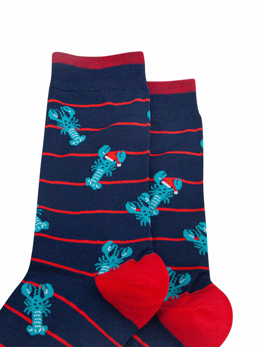 close up of the lobster pattern showing clearly the blue lobsters wearing festive santa hats