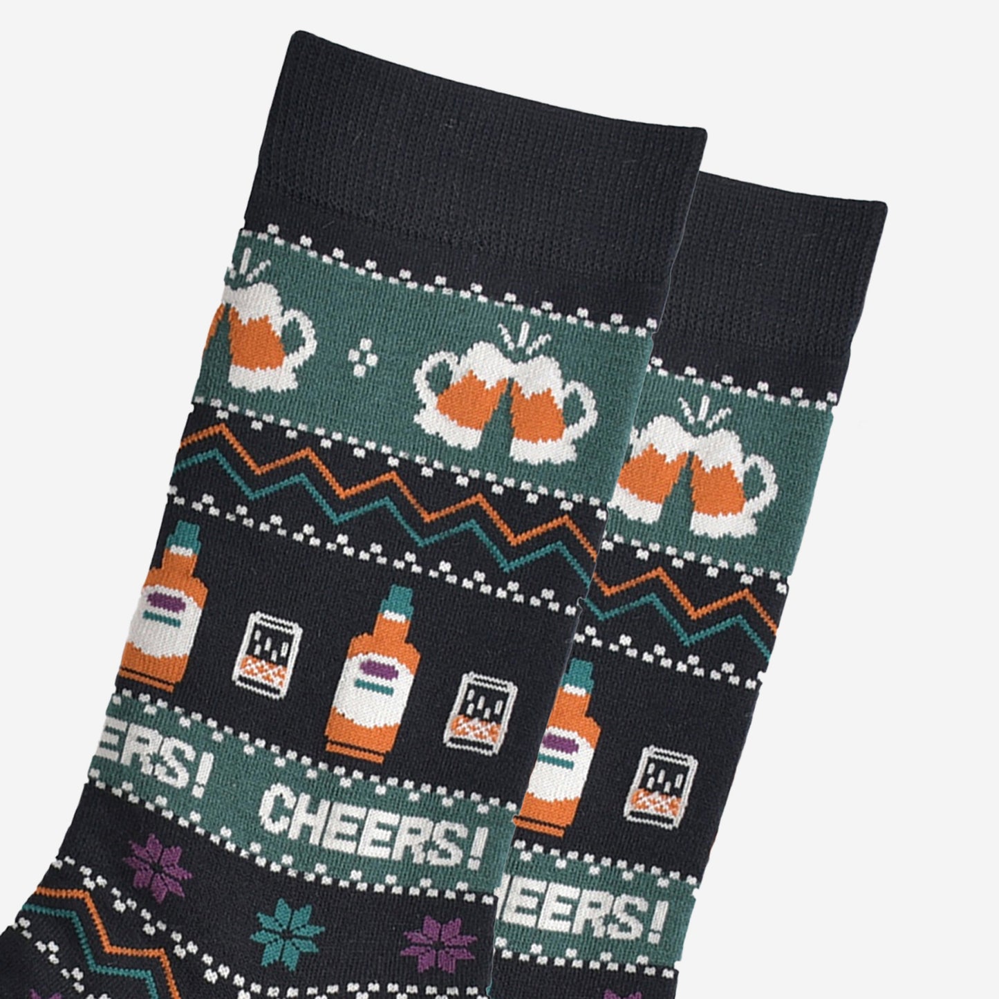 close up of the socks, showing clearly the beer glasses, whisky bottles and the fair isle pattern