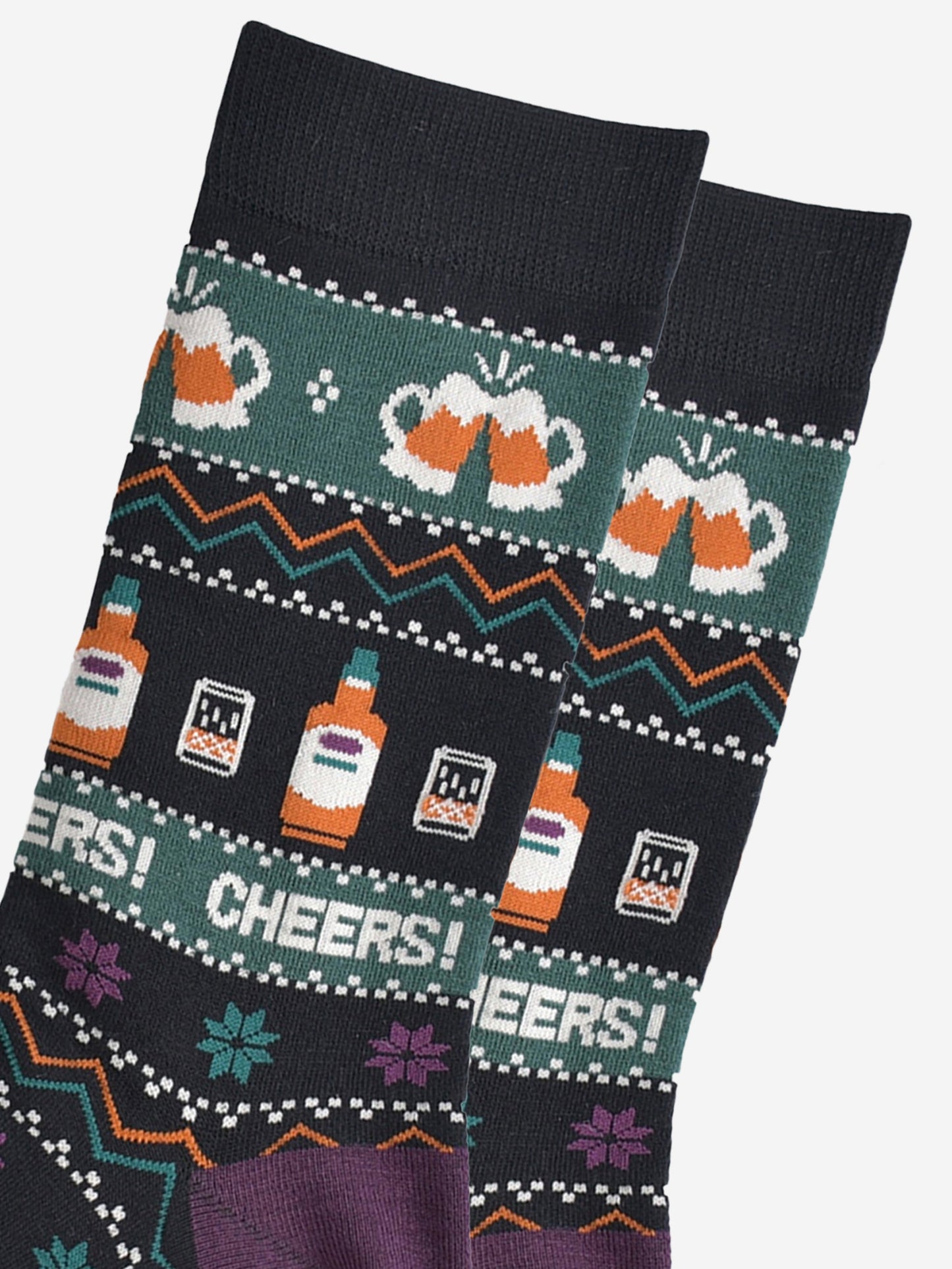 close up of the socks, showing clearly the beer glasses, whisky bottles and the fair isle pattern