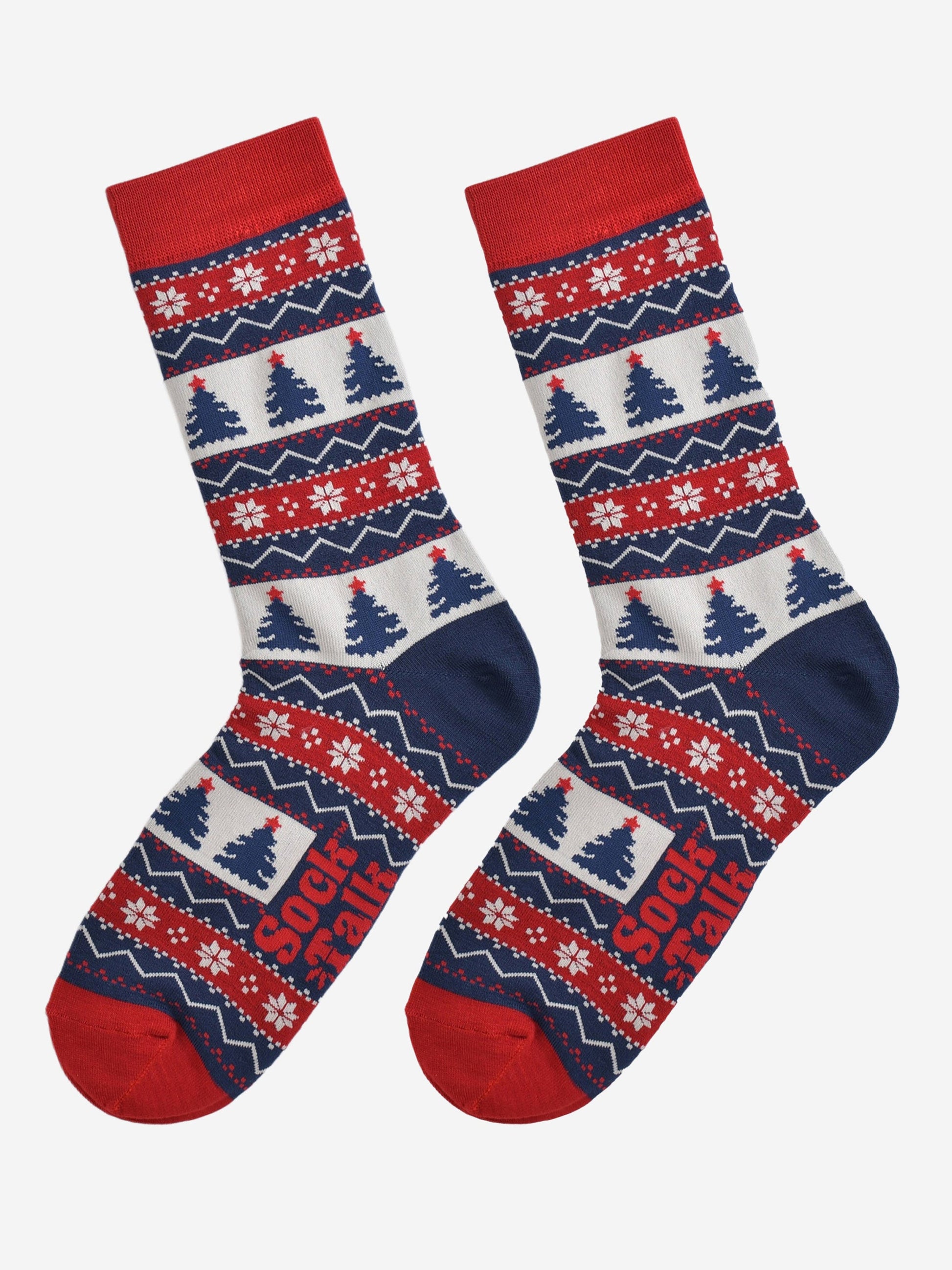 fair isle christmas tree socks laying flat, showing the all over pattern featuring snow flakes, xmas tress and zig zag patterns