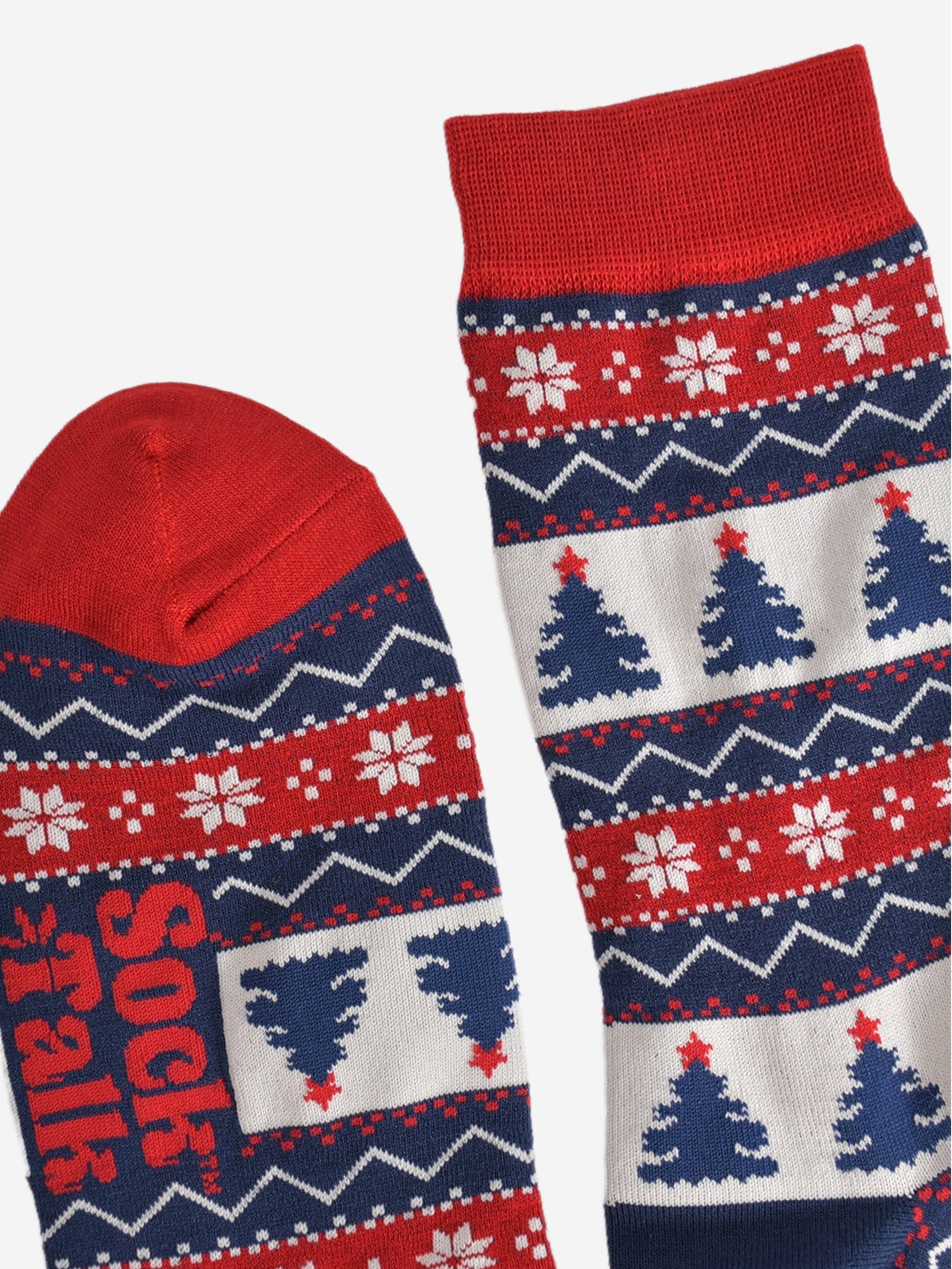 showing the cuff and toe of the socks, both are red in keeping with the colours of the fair isle pattern