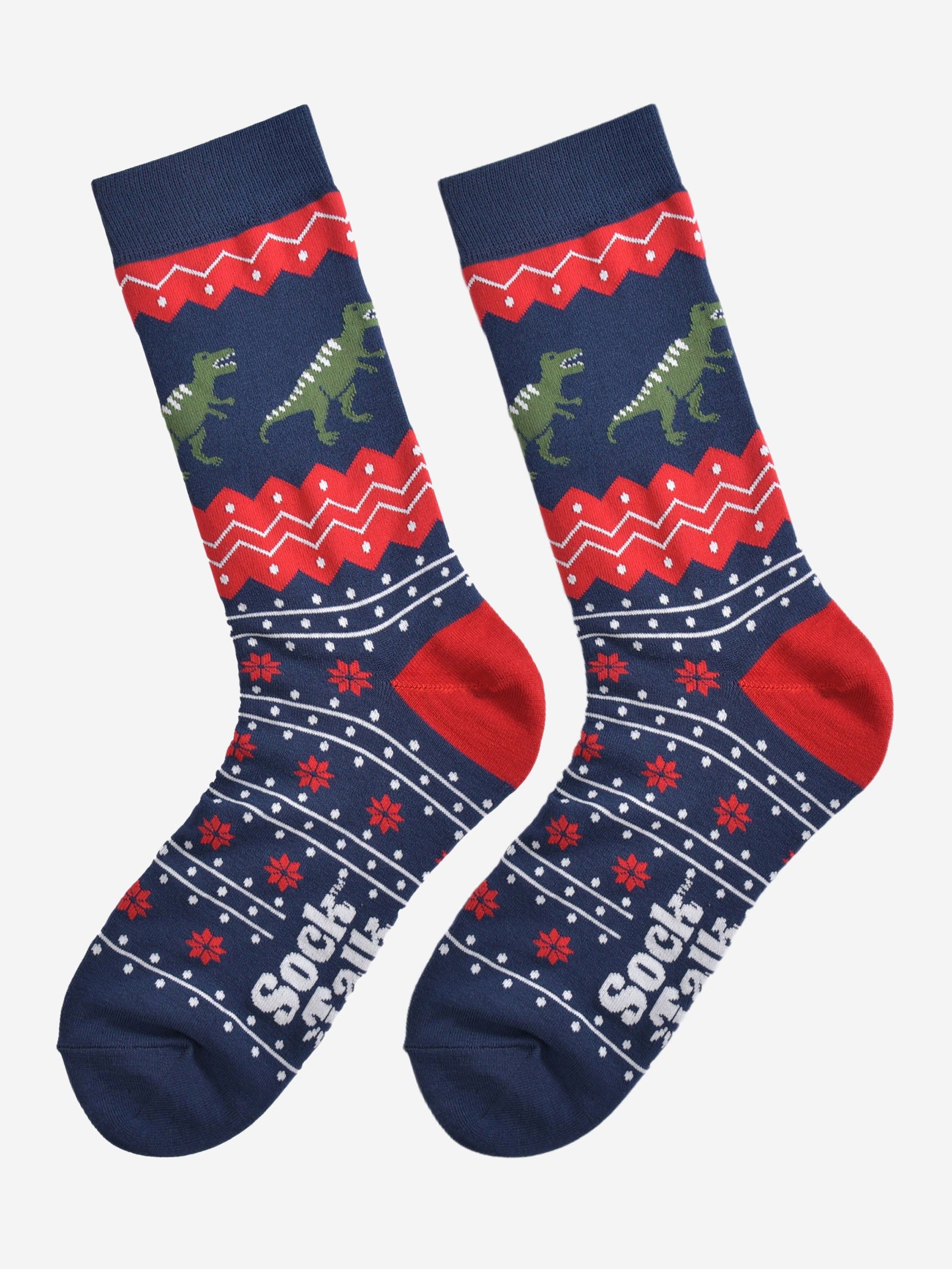 fair isle t-rex socks laying flat, showing an all over navy and red fair isle pattern with green t-rex dinosaurs around the ankles