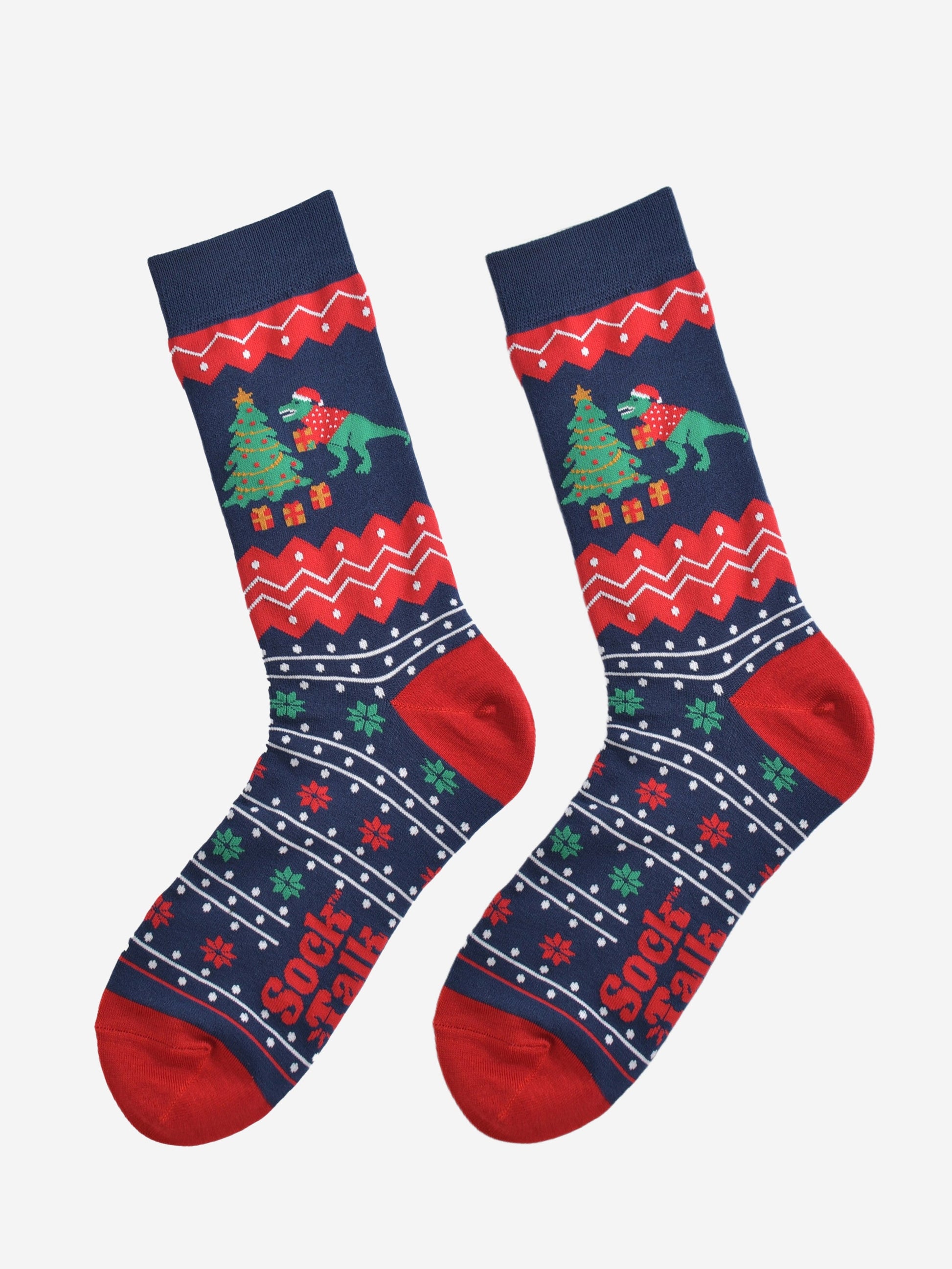 navy blue and red fair isle pattern socks laying flat, showing clearly the detail of the pattern and t-rex xmas tree design on the ankle of the socks