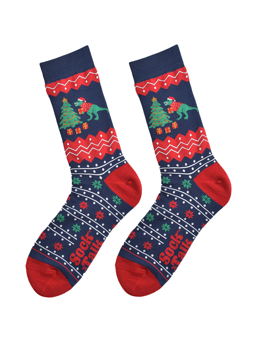 navy blue and red fair isle pattern socks laying flat, showing clearly the detail of the pattern and t-rex xmas tree design on the ankle of the socks