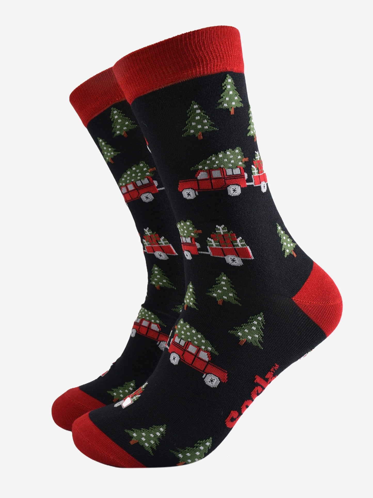 black socks with a pattern of red off road vehicles, xmas trees and Christmas gifts