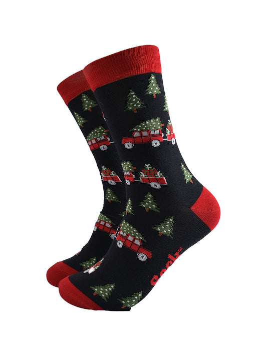 black socks with a pattern of red off road vehicles, xmas trees and Christmas gifts