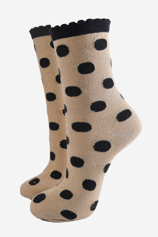 gold ankle socks with an all over black polka dot pattern