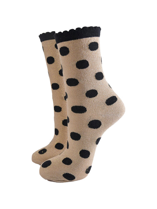 gold ankle socks with an all over black polka dot pattern