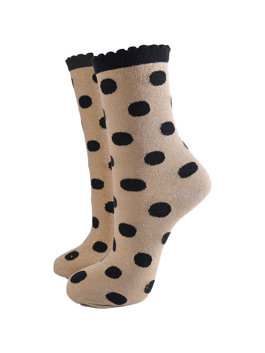 gold ankle socks with an all over black polka dot pattern