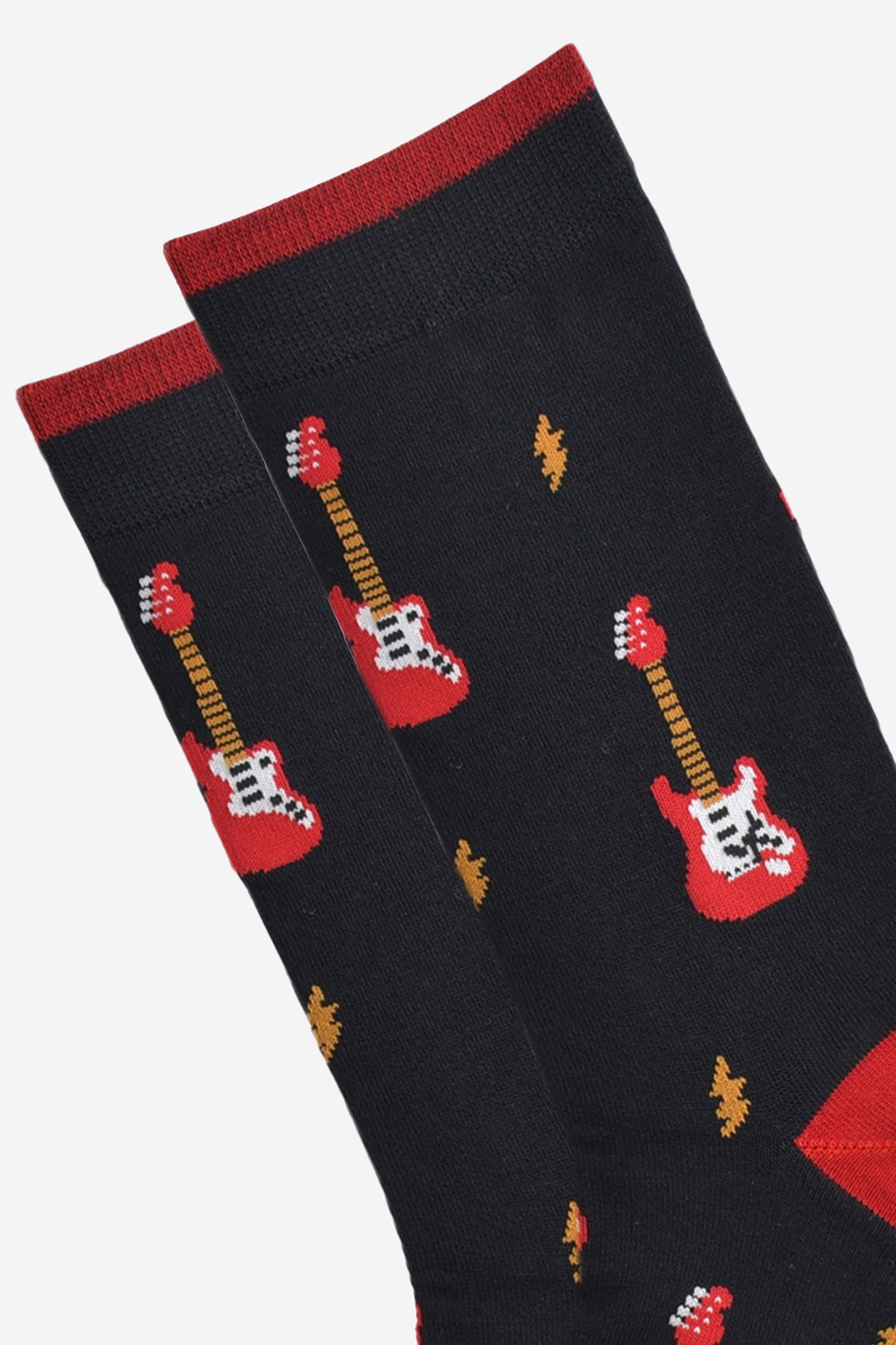 close up of the red electric guitar and lightning bolt pattern on the socks