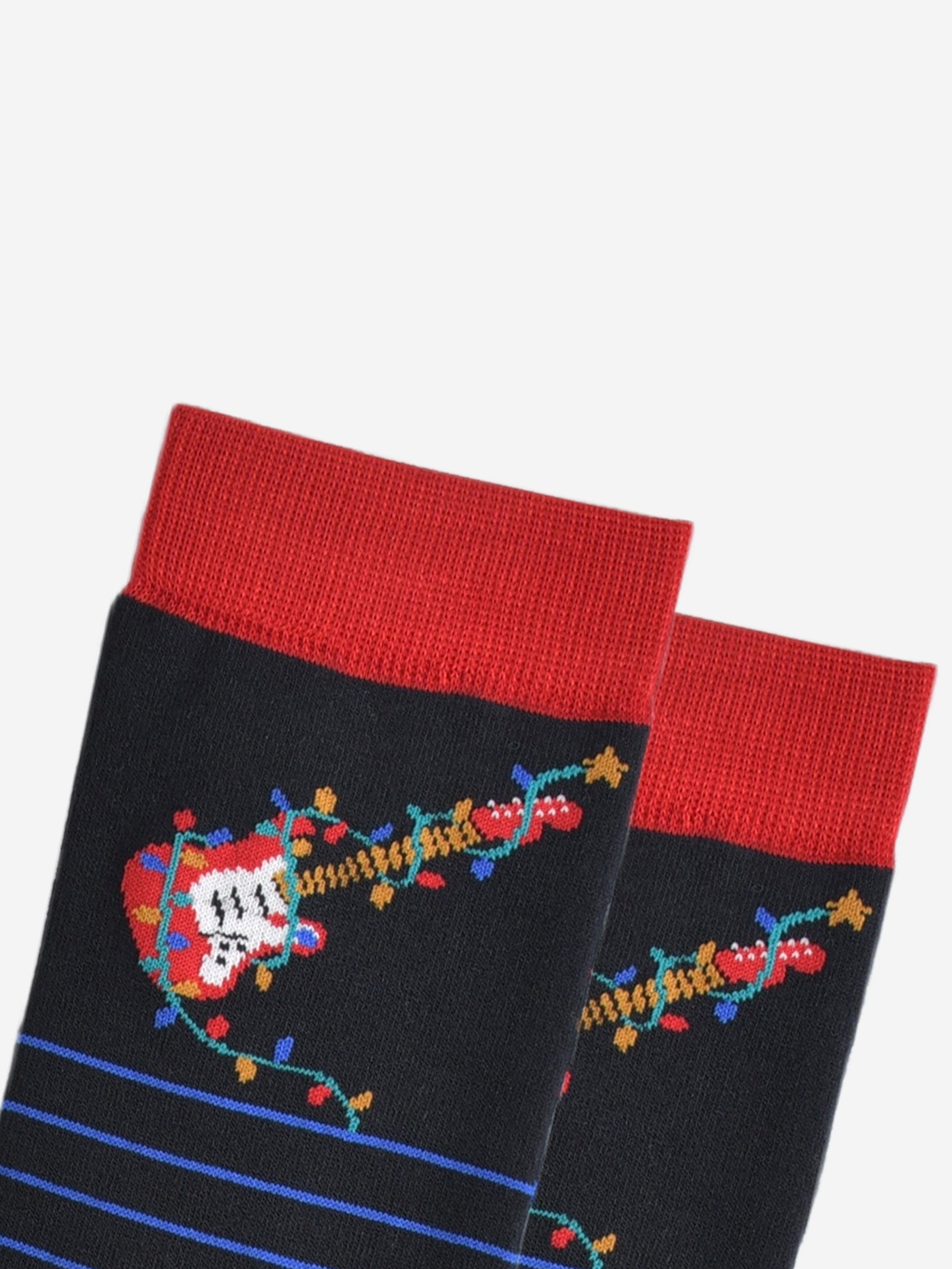 close up of the red electric guitar and multicoloured party lights on the ankle of the socks, the party lights are wrapped around the guitar