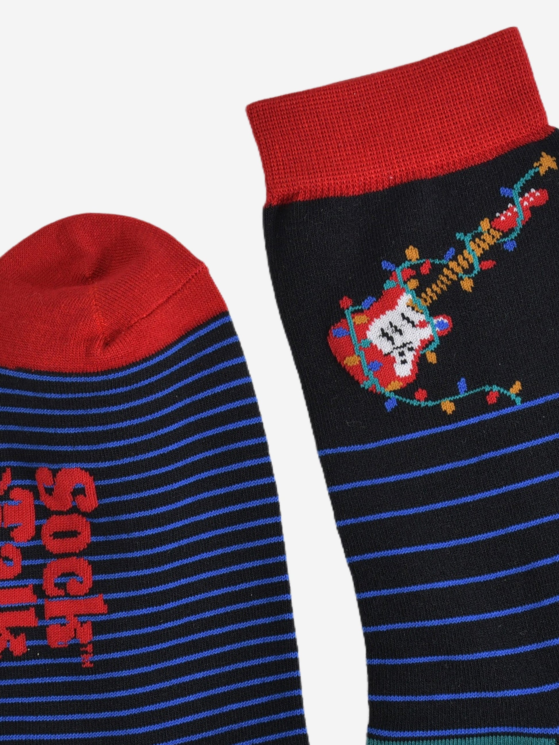 close up of the cuff and toe of the socks, both are red in contrast to the black and blue of the socks
