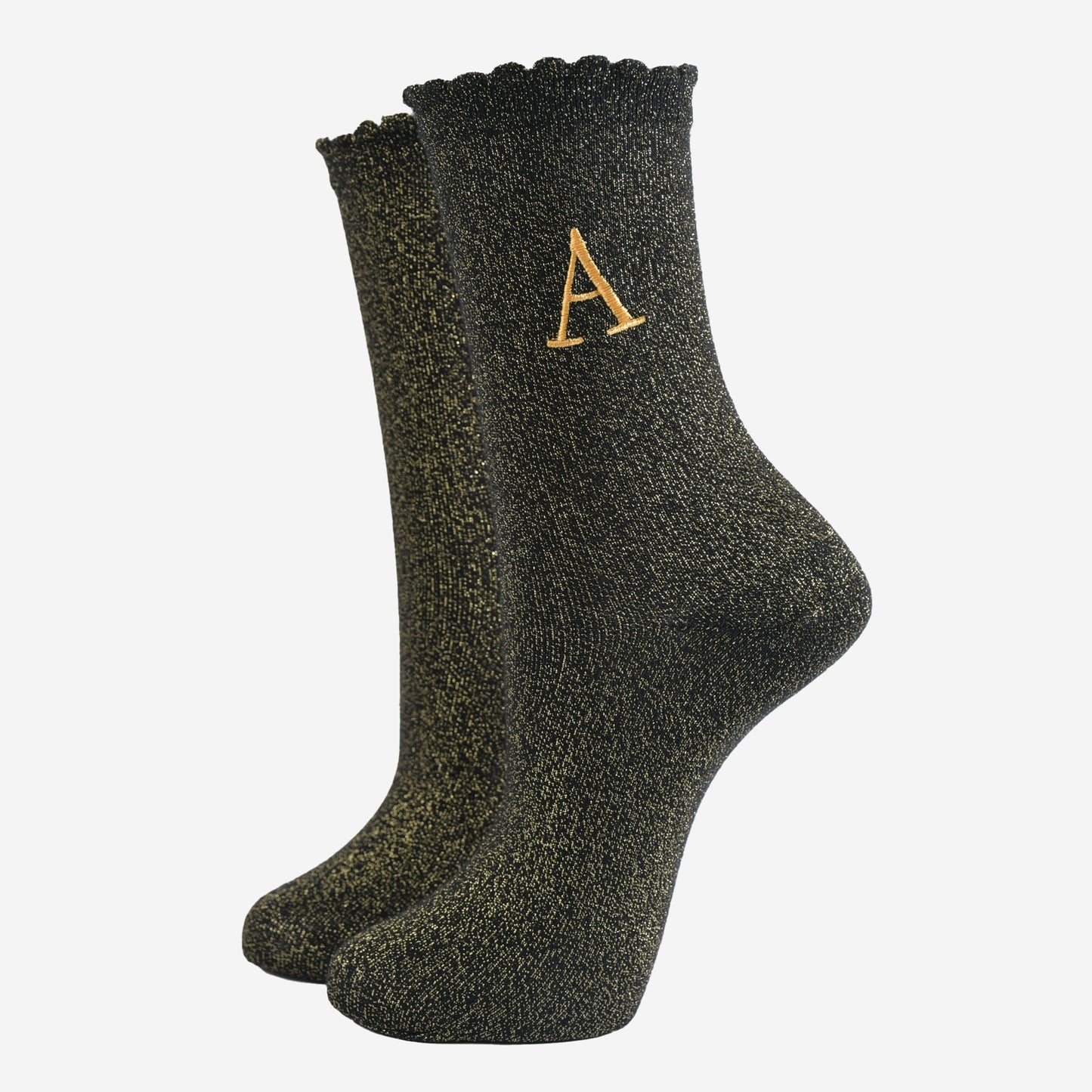 black ankle socks with a scalloped cuff, with an all over gold glitter sparkle and an embroidered gold letter a on the ankle