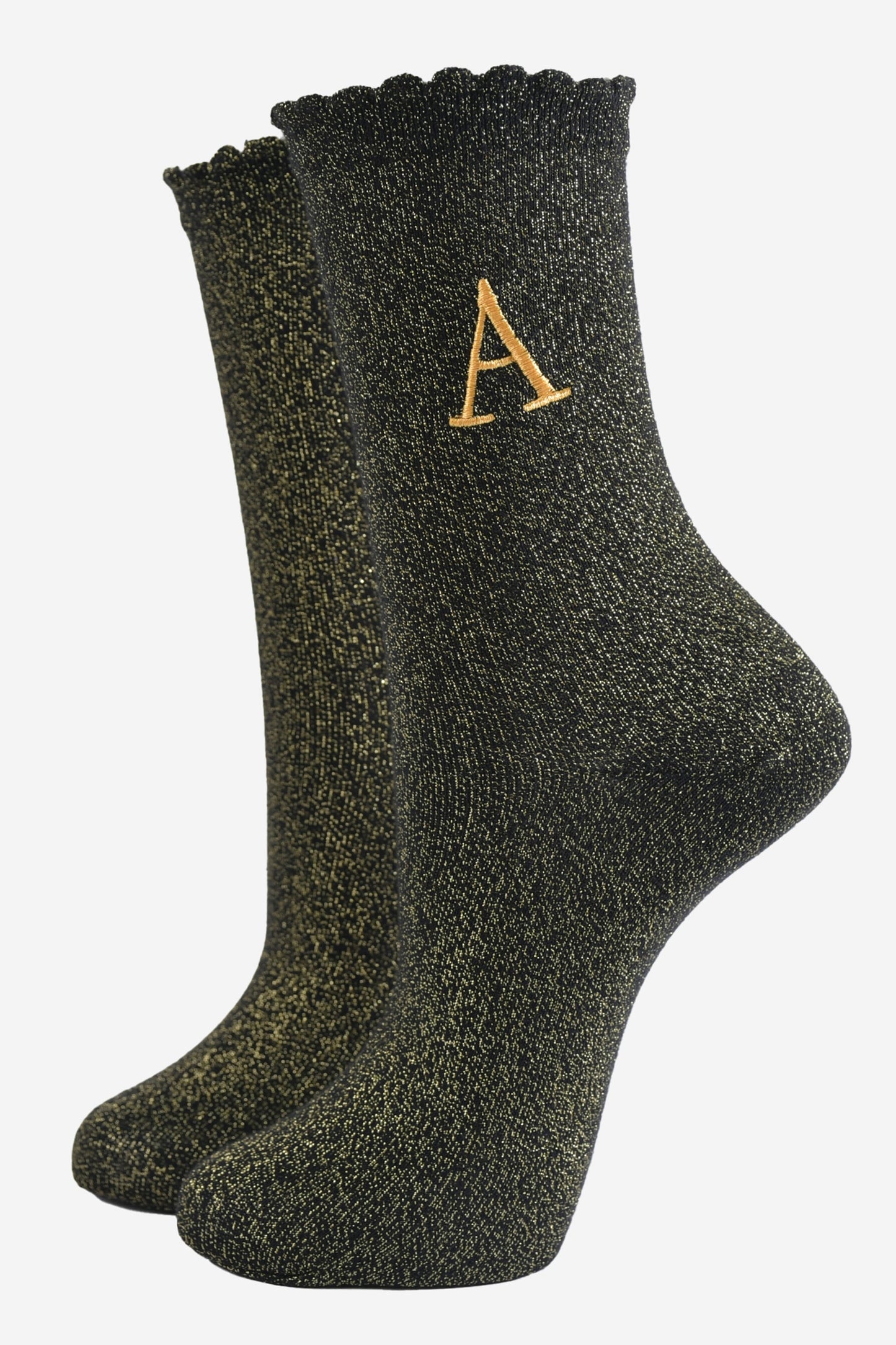 black ankle socks with a scalloped cuff, with an all over gold glitter sparkle and an embroidered gold letter a on the ankle