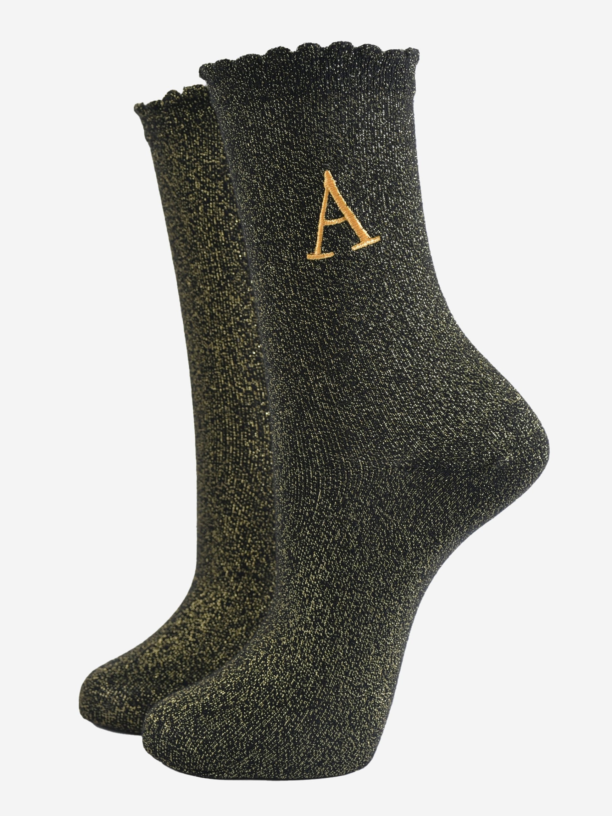 black ankle socks with a scalloped cuff, with an all over gold glitter sparkle and an embroidered gold letter a on the ankle