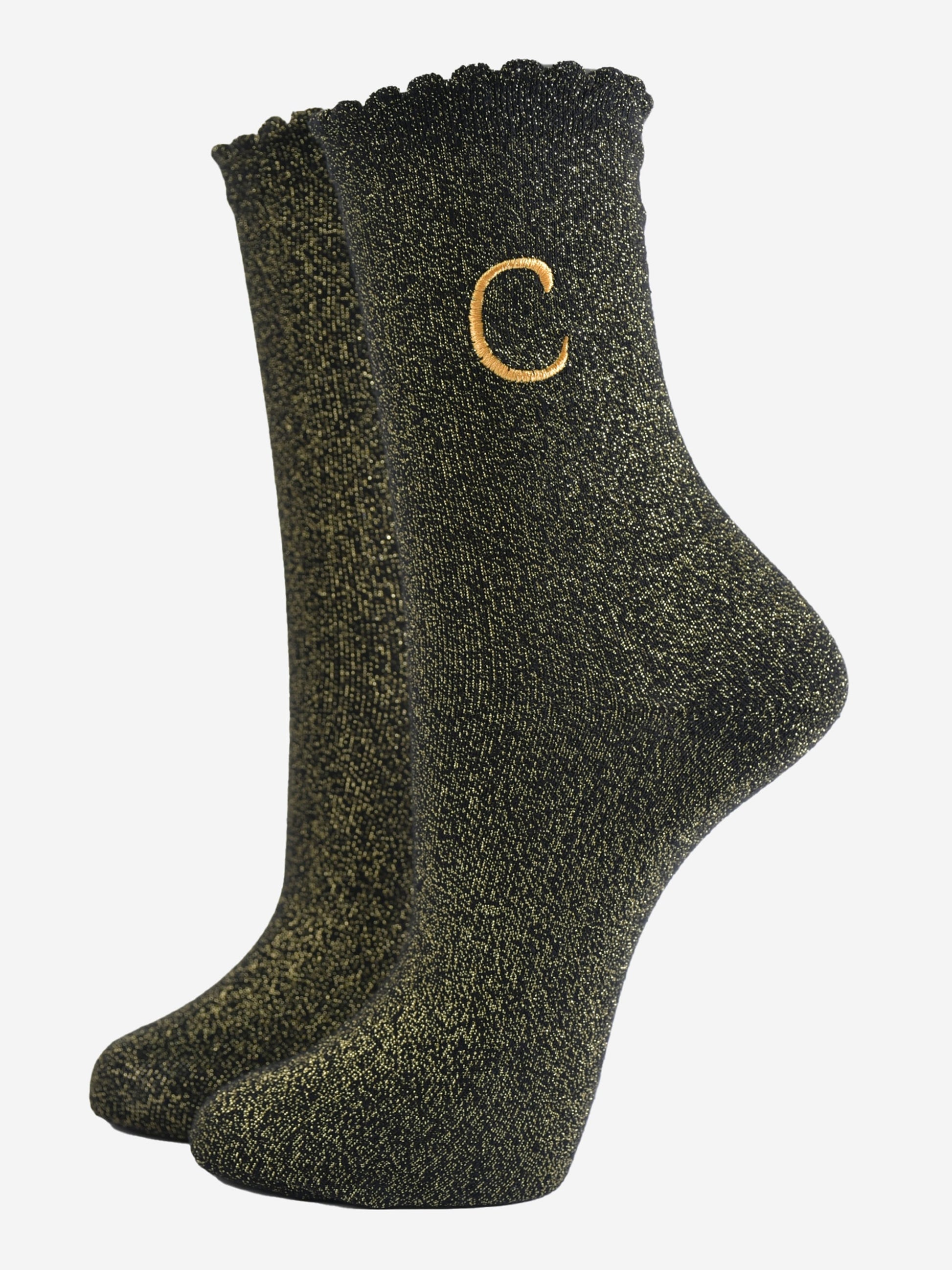 black ankle socks with a scalloped cuff, with an all over gold glitter sparkle and an embroidered gold letter c on the ankle