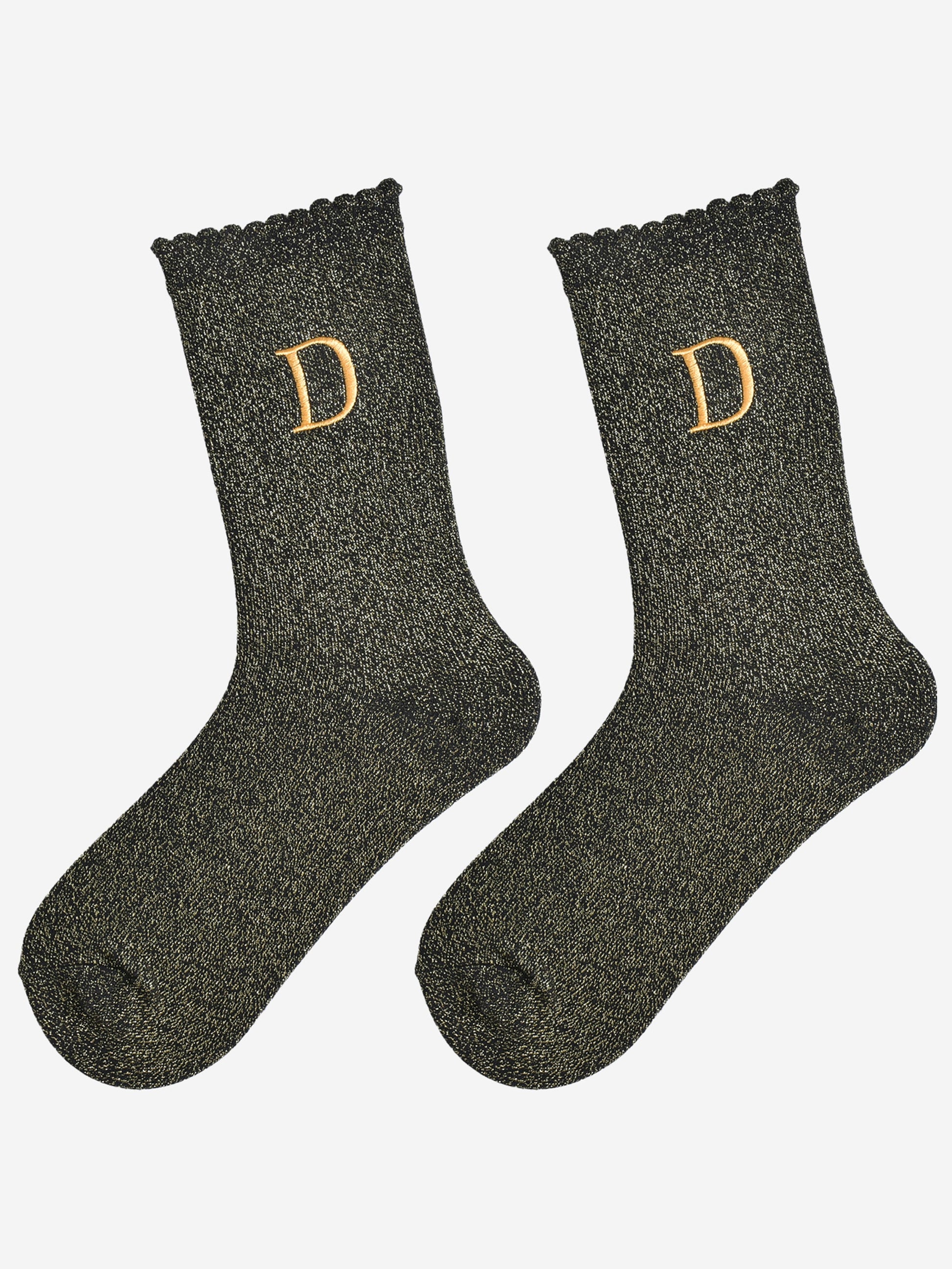 showing the glitter socks laying flat, they have a scalloped cuff and an all over gold sparkle