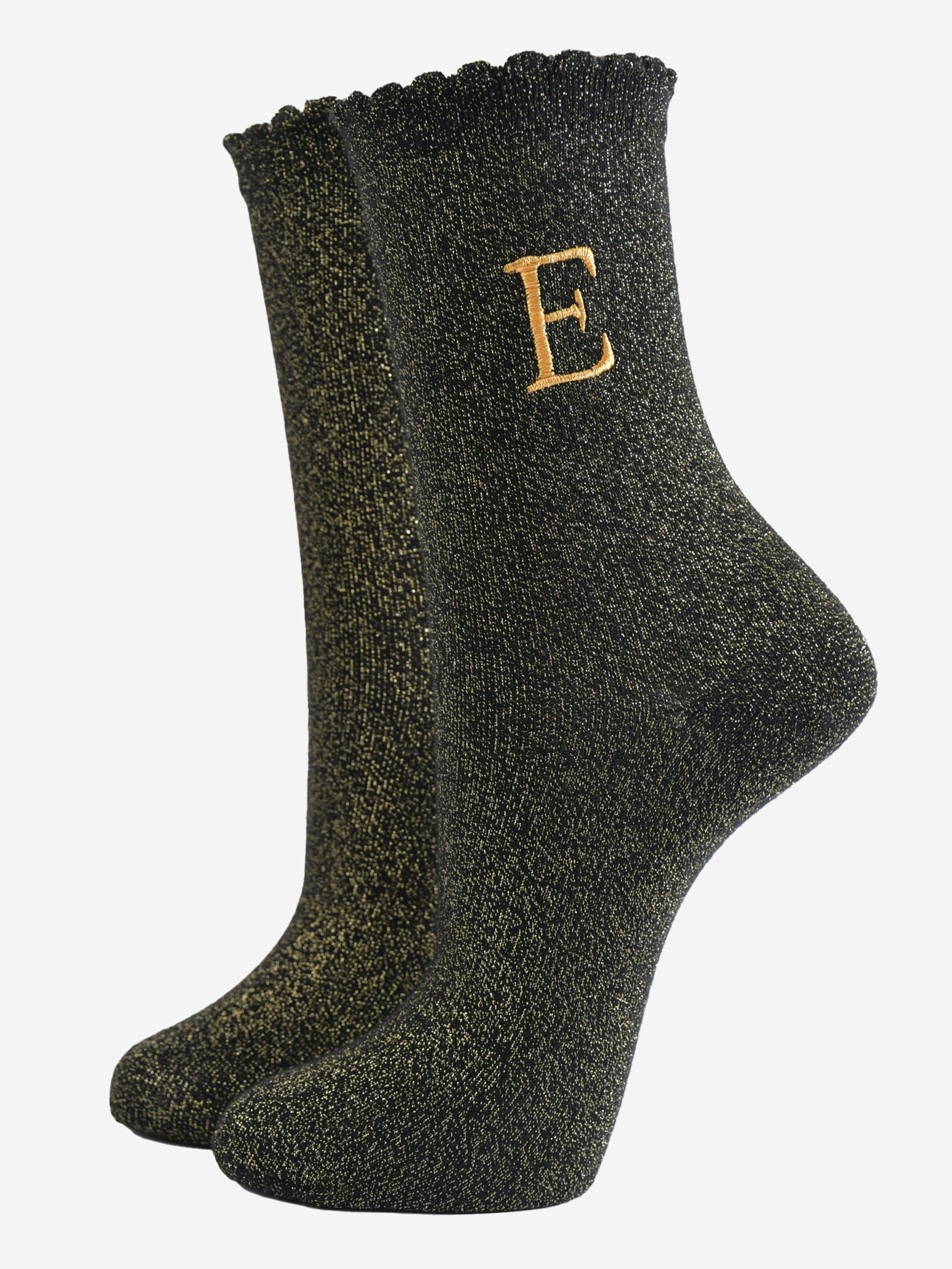 black ankle socks with a scalloped cuff, with an all over gold glitter sparkle and an embroidered gold letter e on the ankle