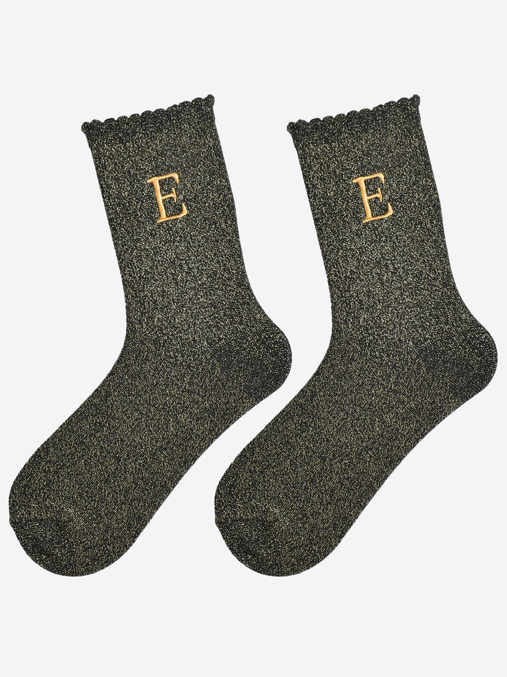 showing the glitter socks laying flat, they have a scalloped cuff and an all over gold sparkle