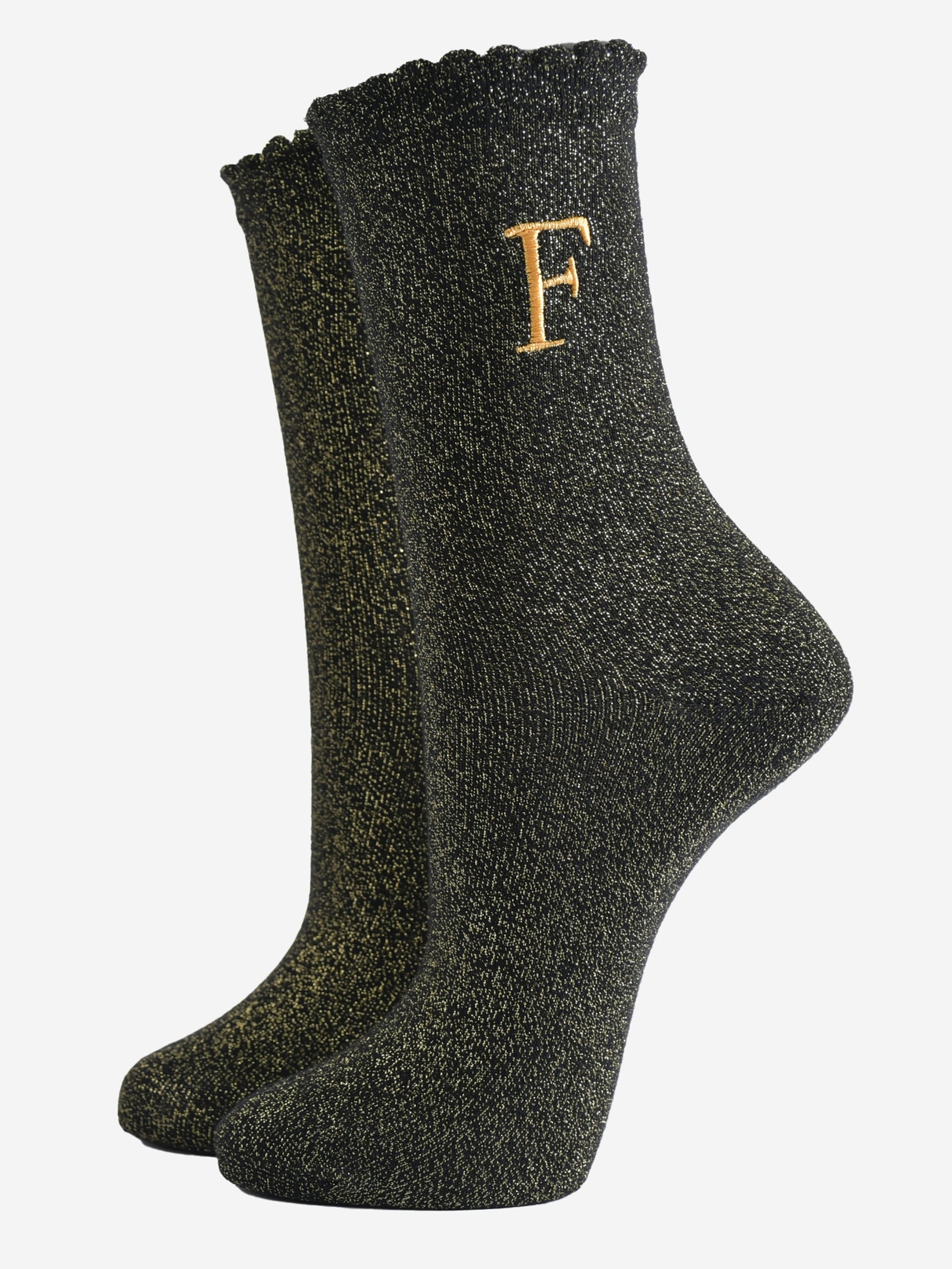 black ankle socks with a scalloped cuff, with an all over gold glitter sparkle and an embroidered gold letter f on the ankle