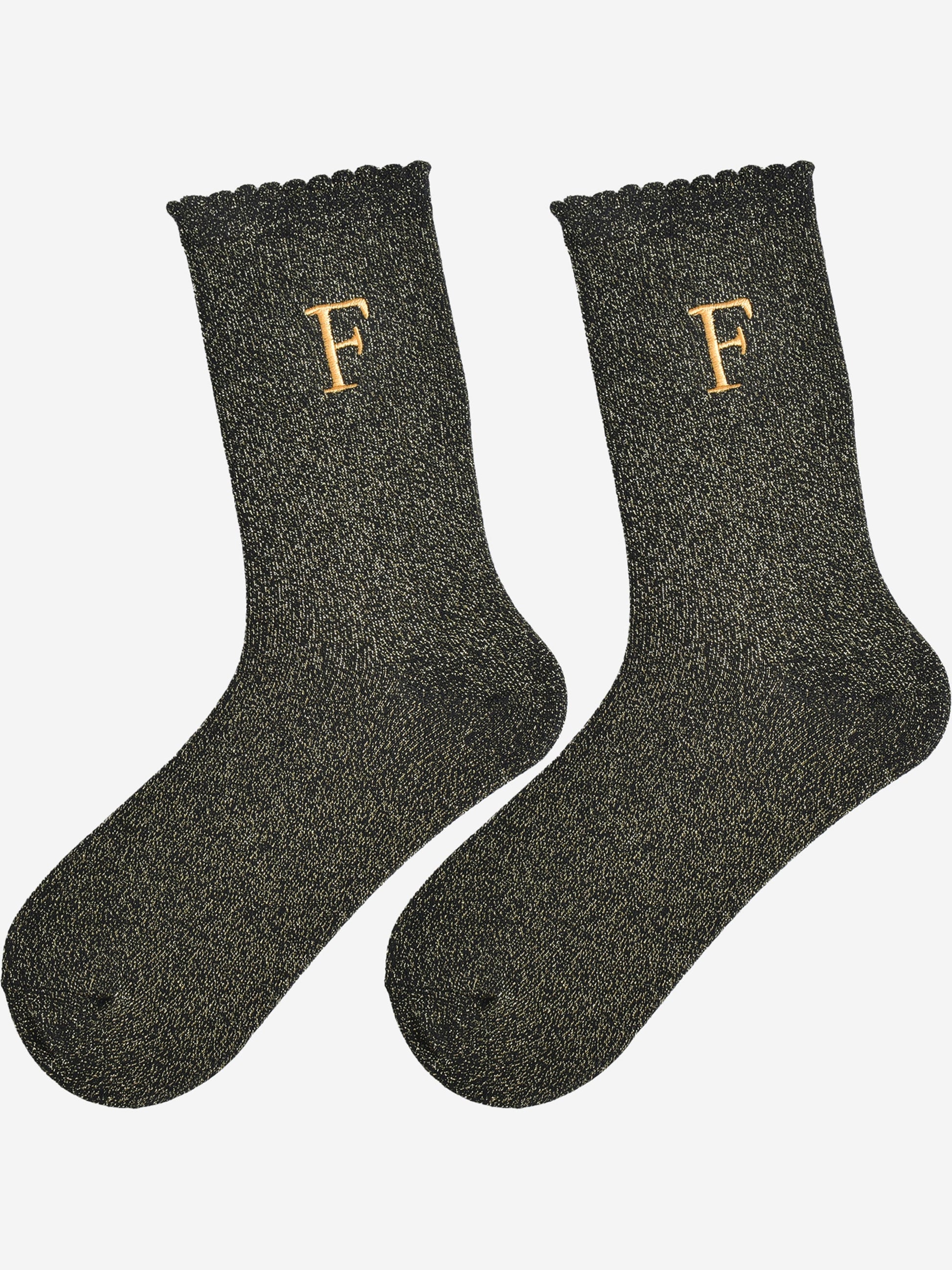 showing the glitter socks laying flat, they have a scalloped cuff and an all over gold sparkle