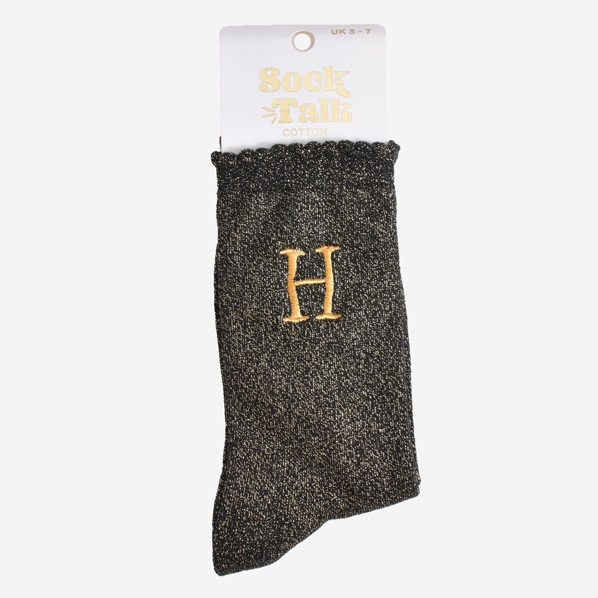 embroidered glitter letter h cotton ankle socks in their sock talk packaging, the socks are a uk size 3-7