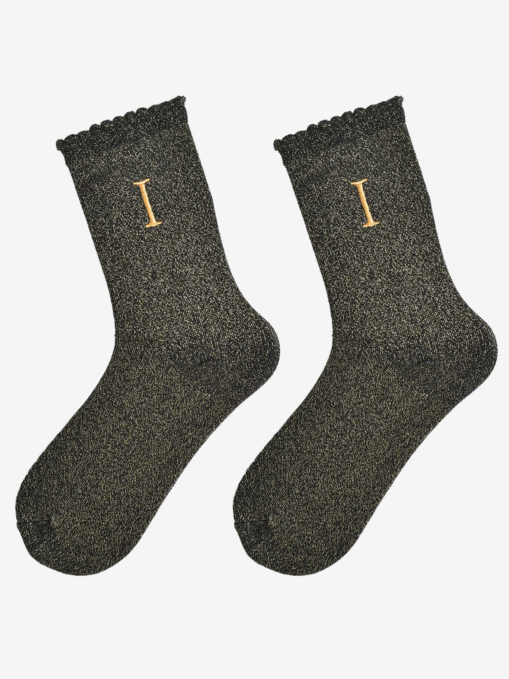 showing the glitter socks laying flat, they have a scalloped cuff and an all over gold sparkle