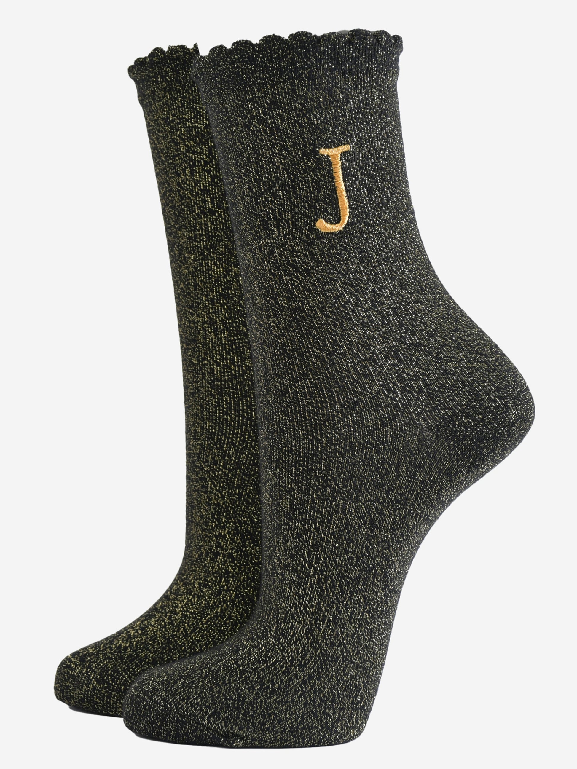 black ankle socks with a scalloped cuff, with an all over gold glitter sparkle and an embroidered gold letter j on the ankle