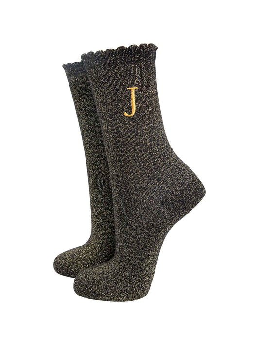 black ankle socks with a scalloped cuff, with an all over gold glitter sparkle and an embroidered gold letter j on the ankle