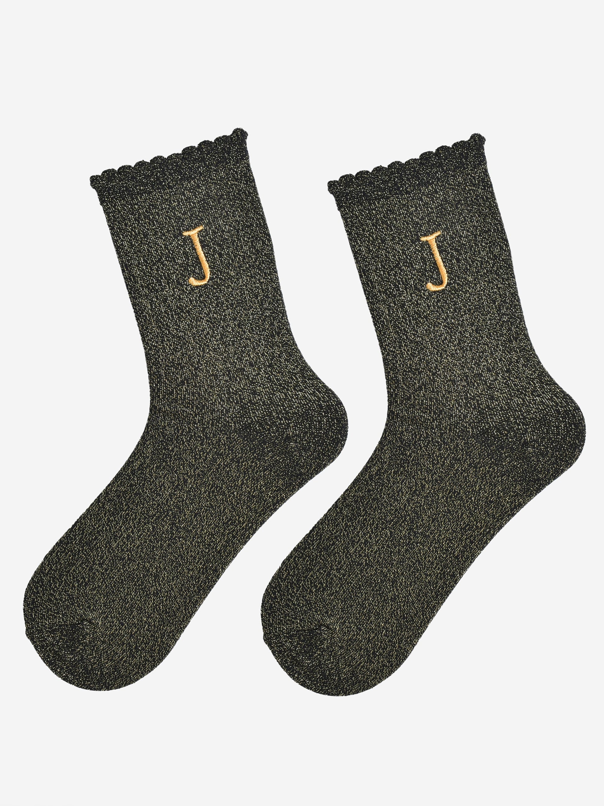 showing the glitter socks laying flat, they have a scalloped cuff and an all over gold sparkle