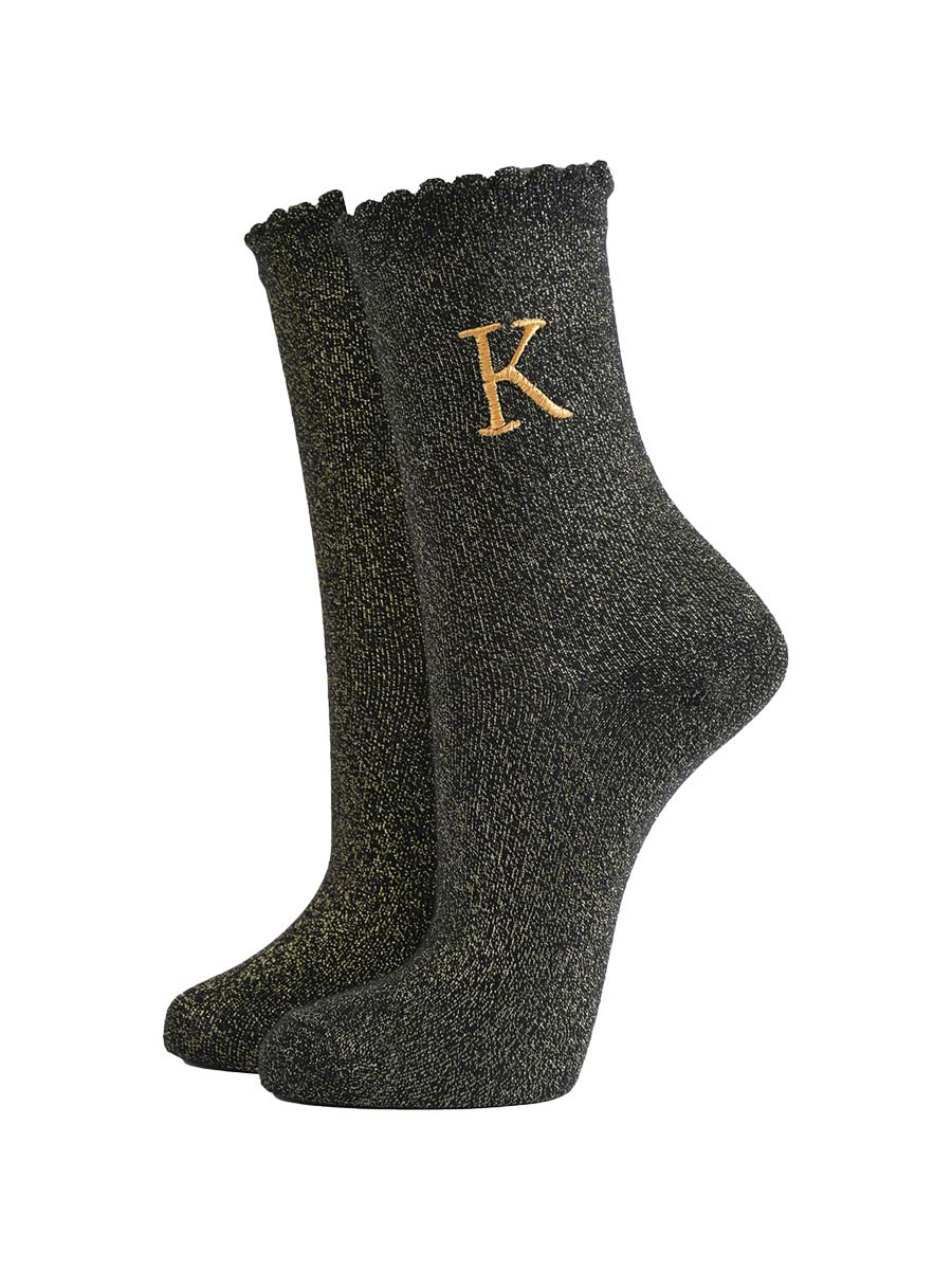 black ankle socks with a scalloped cuff, with an all over gold glitter sparkle and an embroidered gold letter k on the ankle