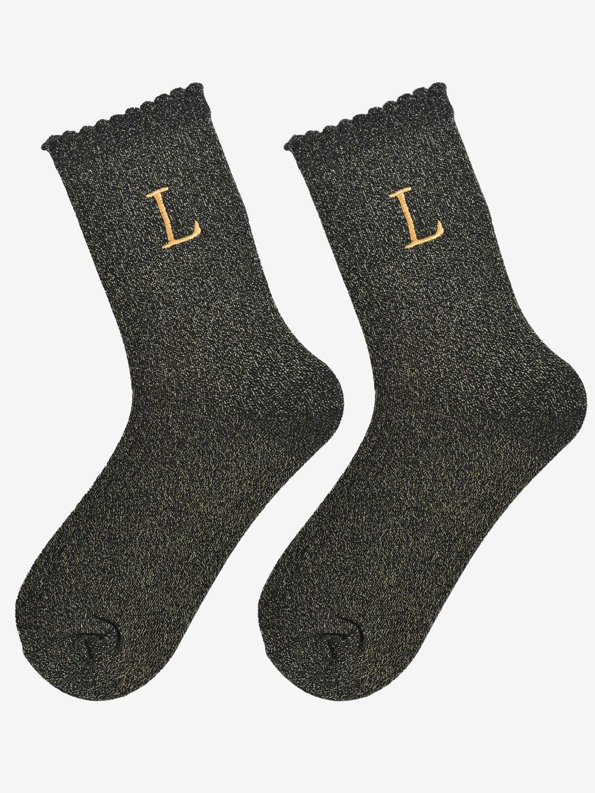 showing the glitter socks laying flat, they have a scalloped cuff and an all over gold sparkle