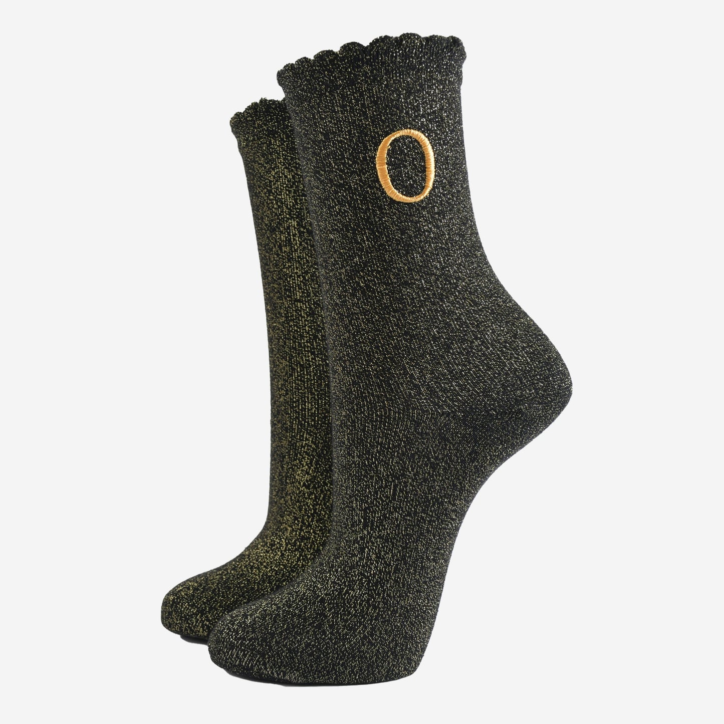 black ankle socks with a scalloped cuff, with an all over gold glitter sparkle and an embroidered gold letter o on the ankle