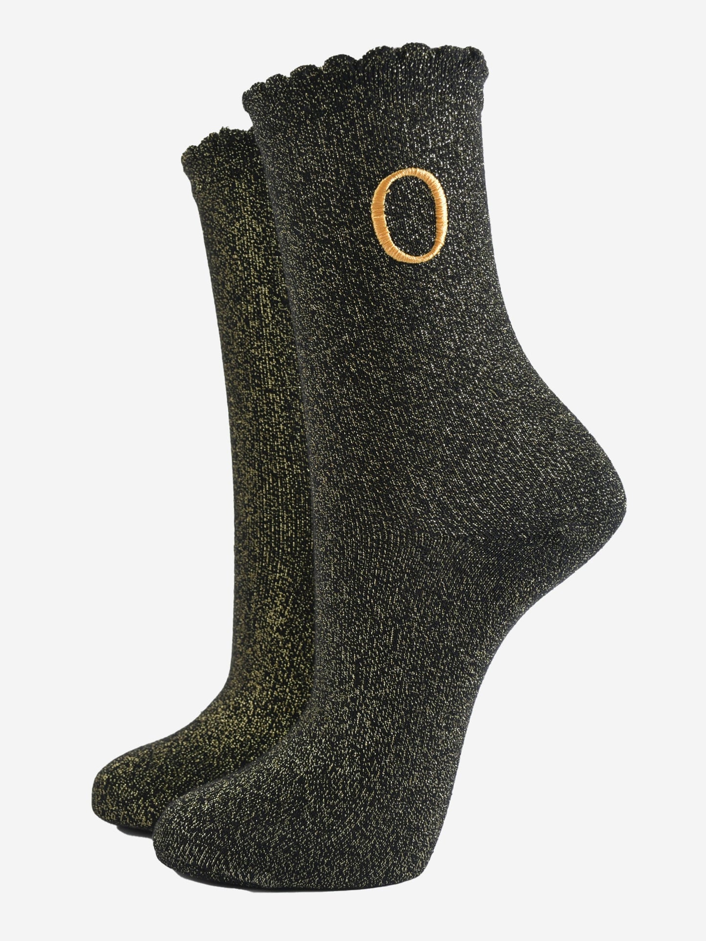 black ankle socks with a scalloped cuff, with an all over gold glitter sparkle and an embroidered gold letter o on the ankle