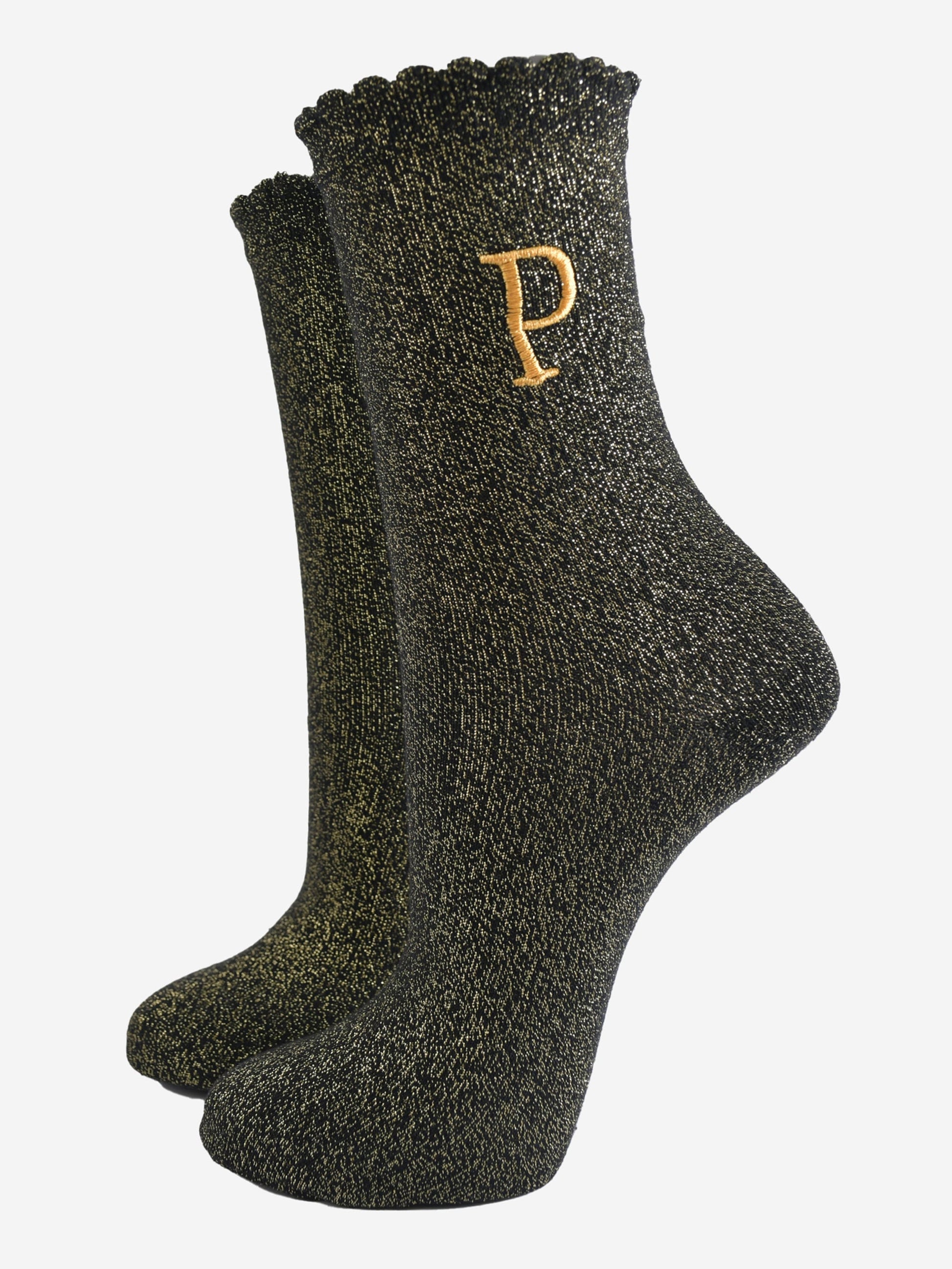 black ankle socks with a scalloped cuff, with an all over gold glitter sparkle and an embroidered gold letter p on the ankle