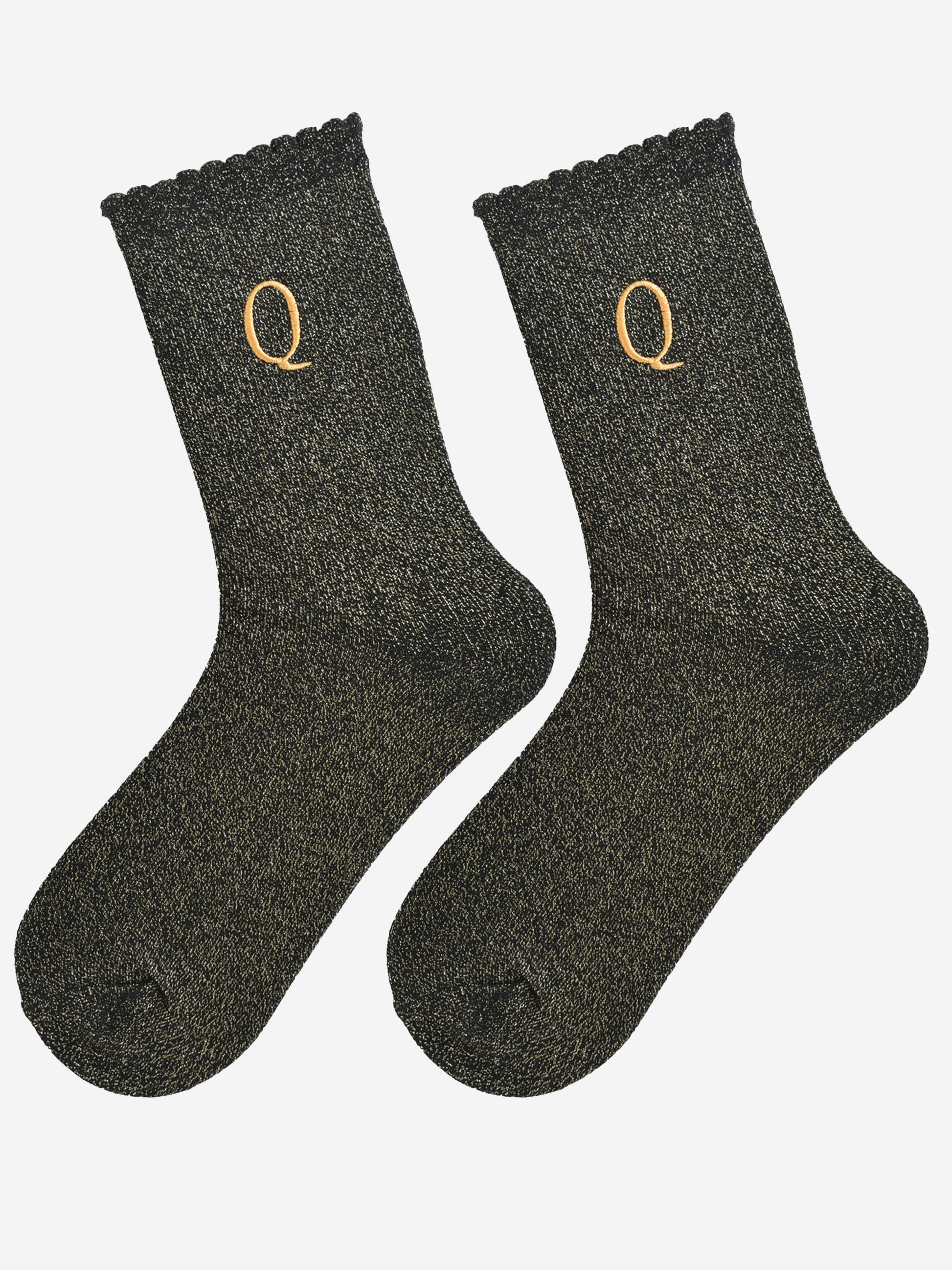 showing the glitter socks laying flat, they have a scalloped cuff and an all over gold sparkle